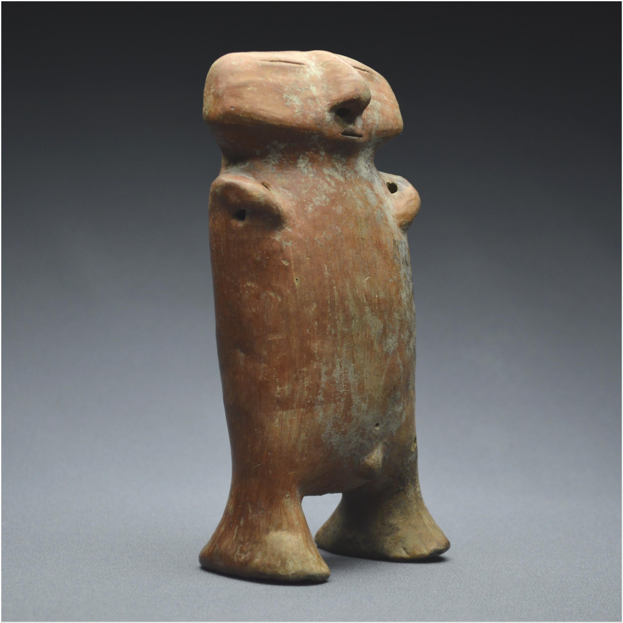 Colombia
Quimbaya Culture / 800 – 1200 AD


Anthropomorphic statuette representing a stylized character. Shown standing, he has an oblong body with atrophied sex and limbs, arms folded over the upper body. The head placed directly on the body