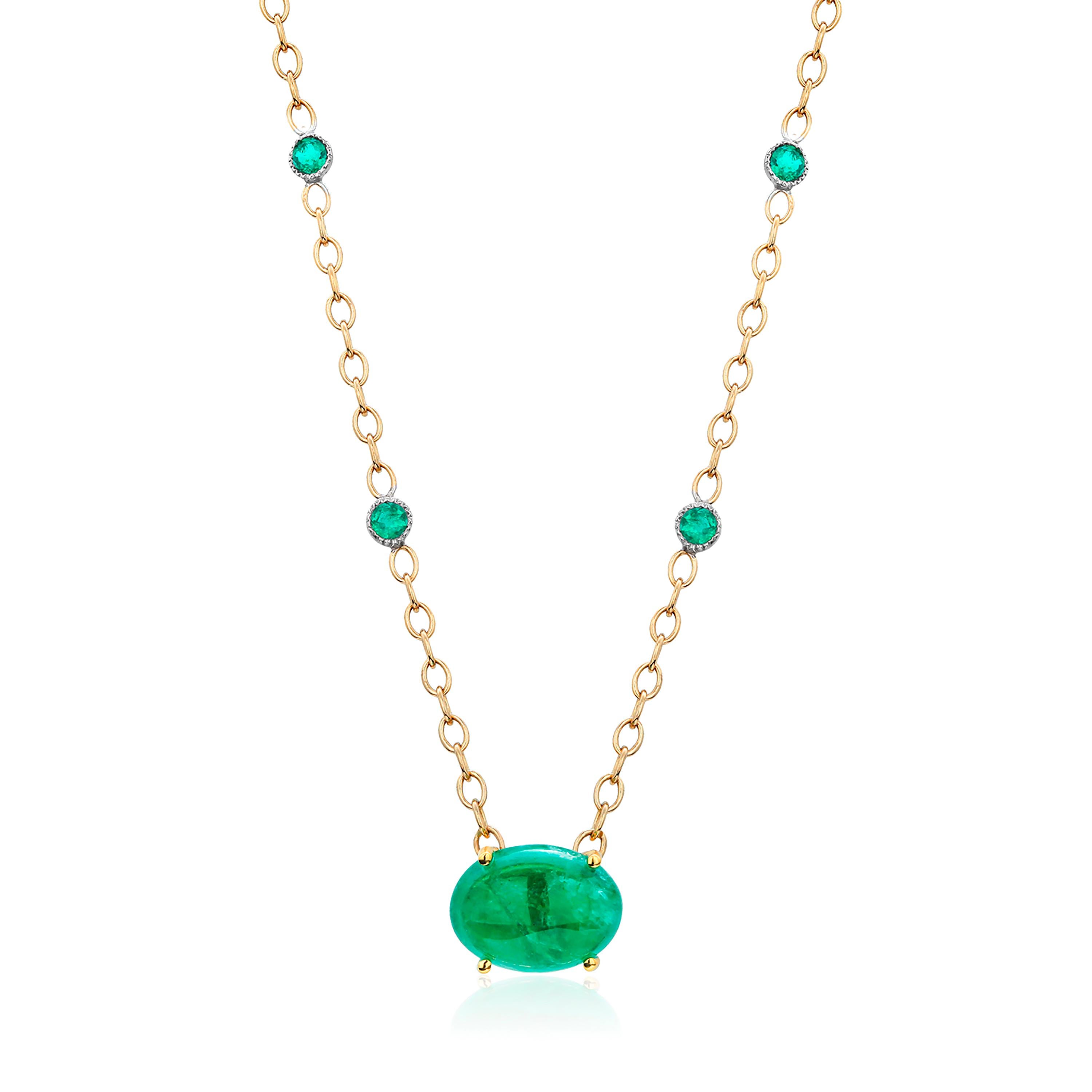 18 karats yellow gold necklace pendant with Colombia cabochon emerald
Necklace measuring 17 inch 
Colombia cabochon emerald weighing 6.46 carats
Four round matched emeralds weighing one carat
Emerald hue tone color is emerald grass green
Cable chain