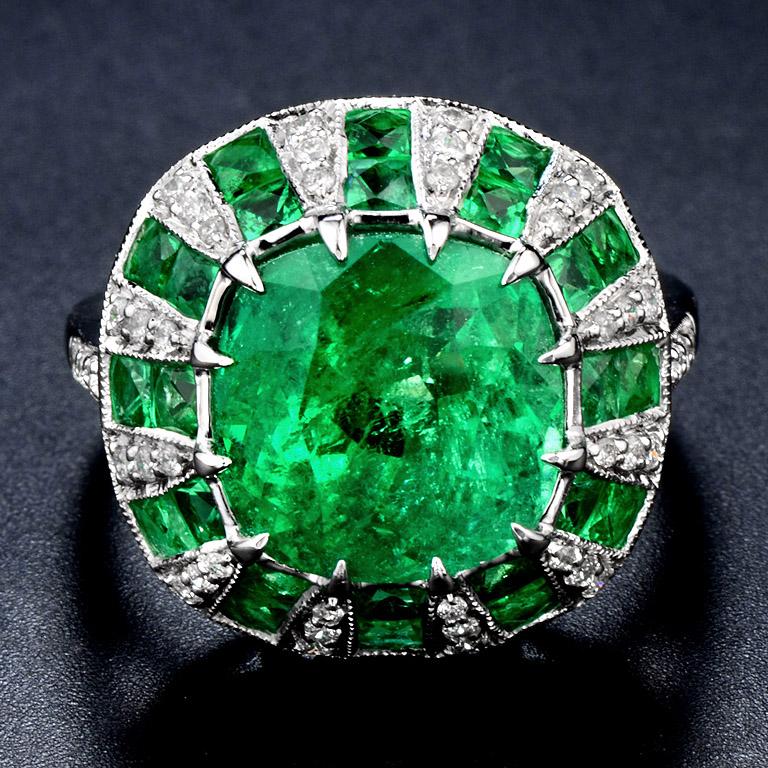 Emerald from Colombia 5.89 Carat in the center hi-lighted by 24 pcs. 2.5 Carat French Cut Emerald and 42 pcs. 0.31 Carat Round Cut Diamond. 

This Ring was made in 18K White Gold size US#7