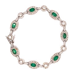Bracciale tennis Colombia con smeraldo e diamanti a raggiera, in oro bianco 18 carati