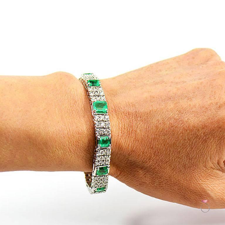 This stunning tennis bracelet is absolutely beautiful, made in 18k white gold with 9 vibrant green natural Colombian Emeralds, each is emerald cut, securely set in four prongs set. The total carat weight of the Emeralds is 6.57 carats. The center