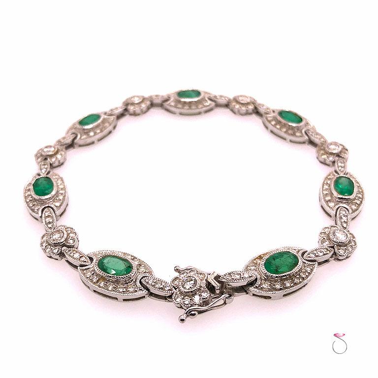 This stunning tennis bracelet is absolutely beautiful, made in 18k white gold with 7 oval shape vibrant green natural Colombian Emeralds. The Emeralds are bezel set with mil-grain details on the bezel. Each emerald weights approximately 0.50 carat