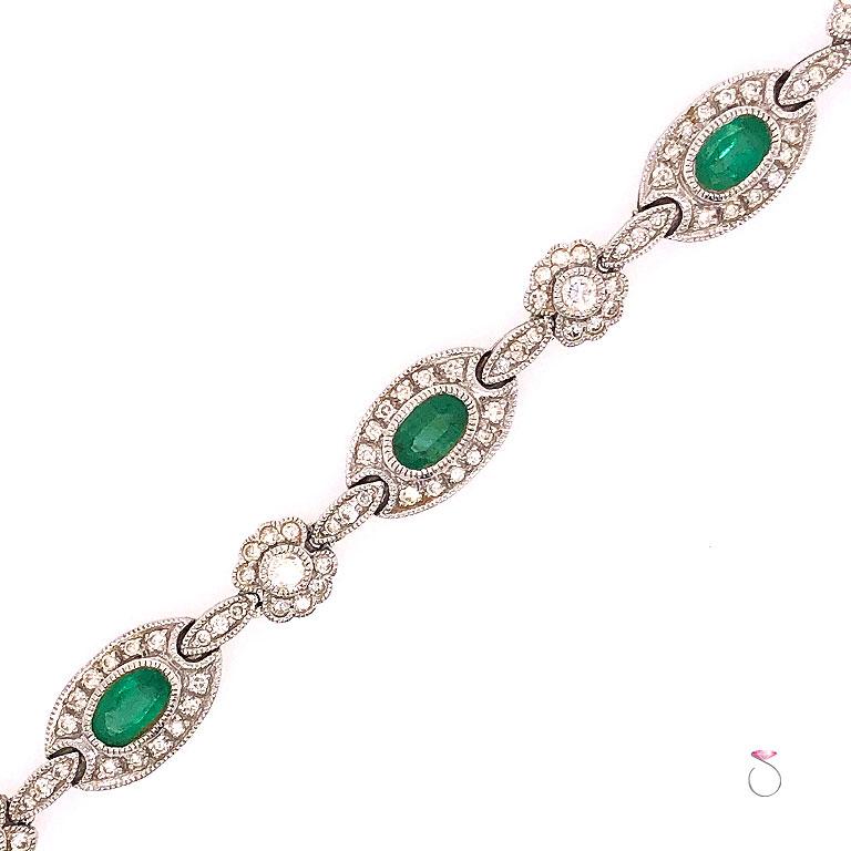 Art Deco Colombia Emerald and Diamond Halo Tennis Bracelet, in 18 Karat White Gold For Sale