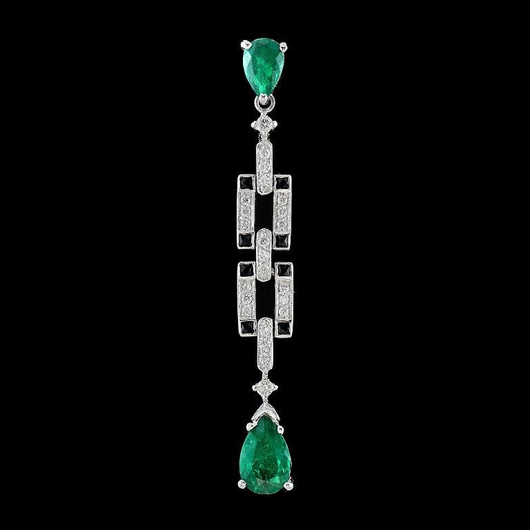 Art Deco Style Pendant with the strong green color Emerald from Colombia 2 pieces 1.80 Carat with Onyx 0.17 Carat and Total Diamond content is 0.30 Carat.

The pendant was made in 18K White Gold.