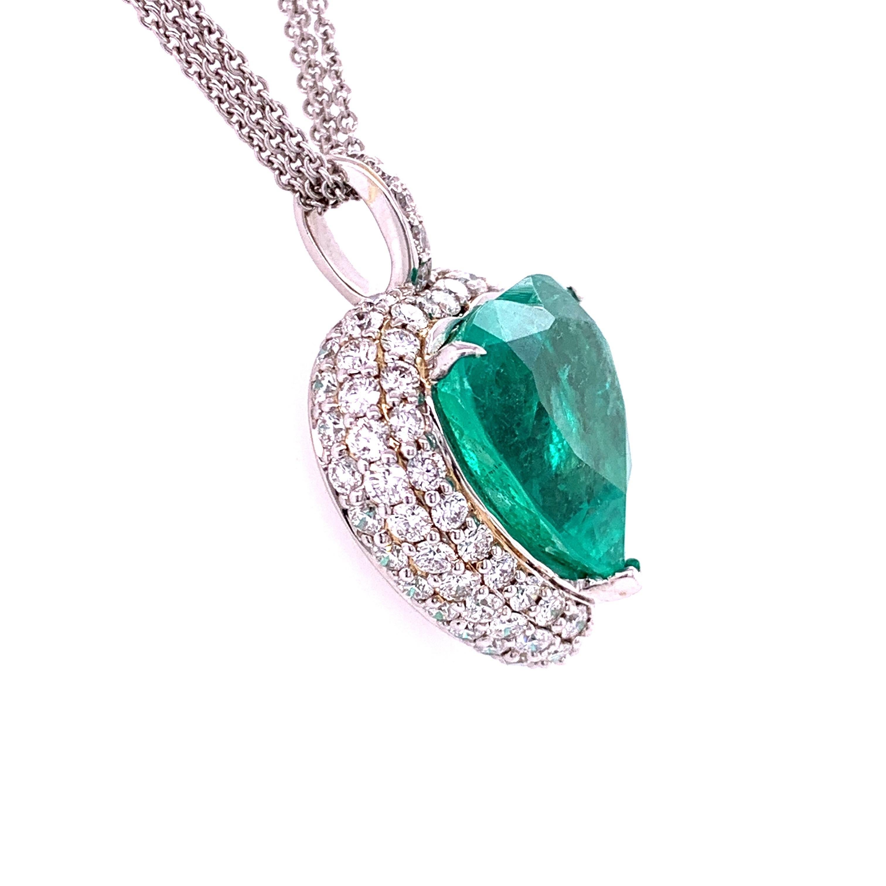Rare emerald diamond pendant. High brilliance, heart shape, lively bluish-green tone, Colombian natural emerald mounted with one split prong, two knife prongs, accented with two of of round brilliant cut diamond. Handcrafted classic design set in 18