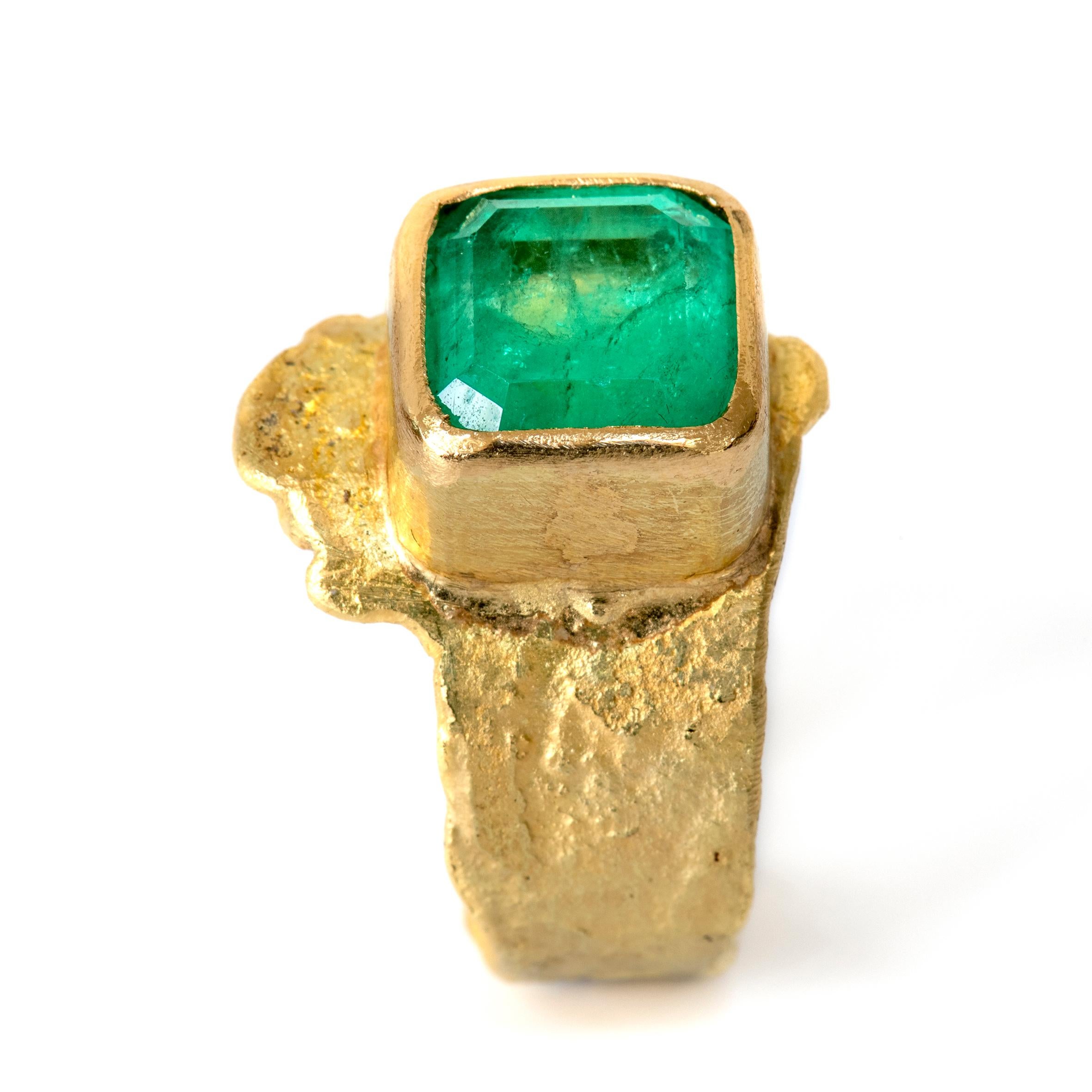 Stunning 4.4 carat Colombian emerald framed in a rub-over setting on a richly textured handmade 18k gold ring.
Disa Allsopp is an internationally recognised Goldsmith known for her rich textured metals and colourful handpicked gemstones. 

This