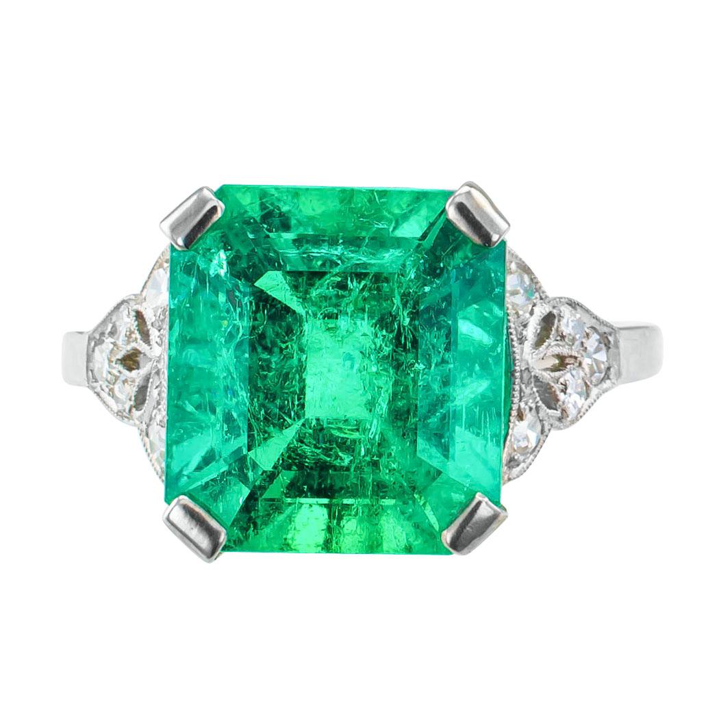 Art Deco 4.05 carat Colombian emerald diamond and platinum ring circa 1930. Showcasing a square emerald-cut emerald weighing 4.05 carats on a platinum Art Deco mounting set with ten small round diamonds totaling approximately 0.25 carat,