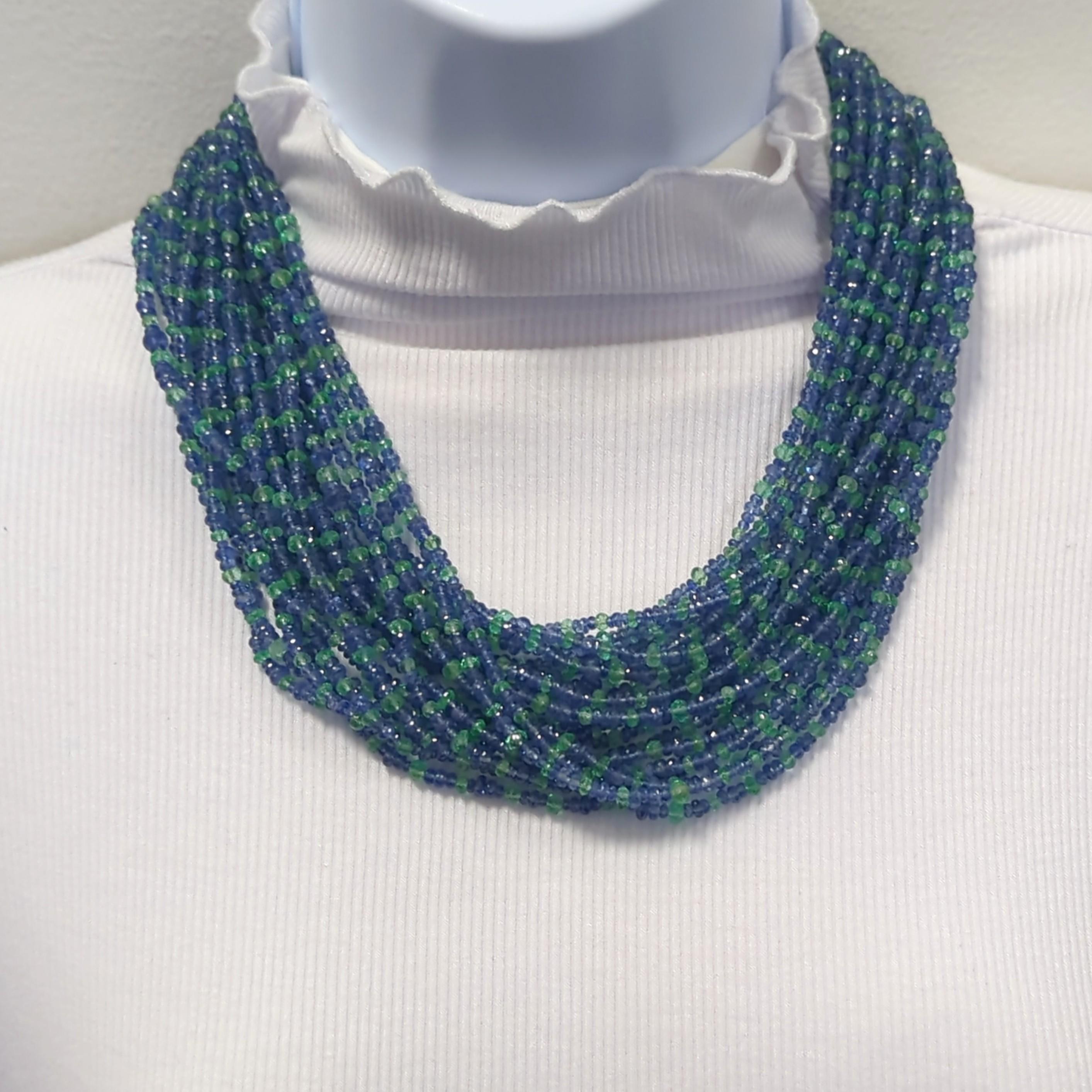Absolutely stunning 307.15 ct. Colombian emerald beads with 936.29 ct. Ceylon blue sapphire beads with a carefully handcrafted clasp in 18k yellow gold.  The clasp has more blue sapphire beads, emerald beads, and white diamond rounds.  This necklace