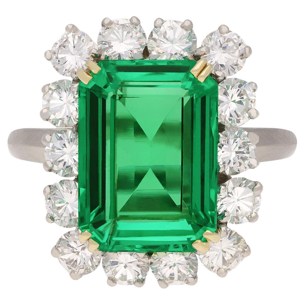 Colombian emerald and diamond coronet cluster ring, French, circa 1960. 