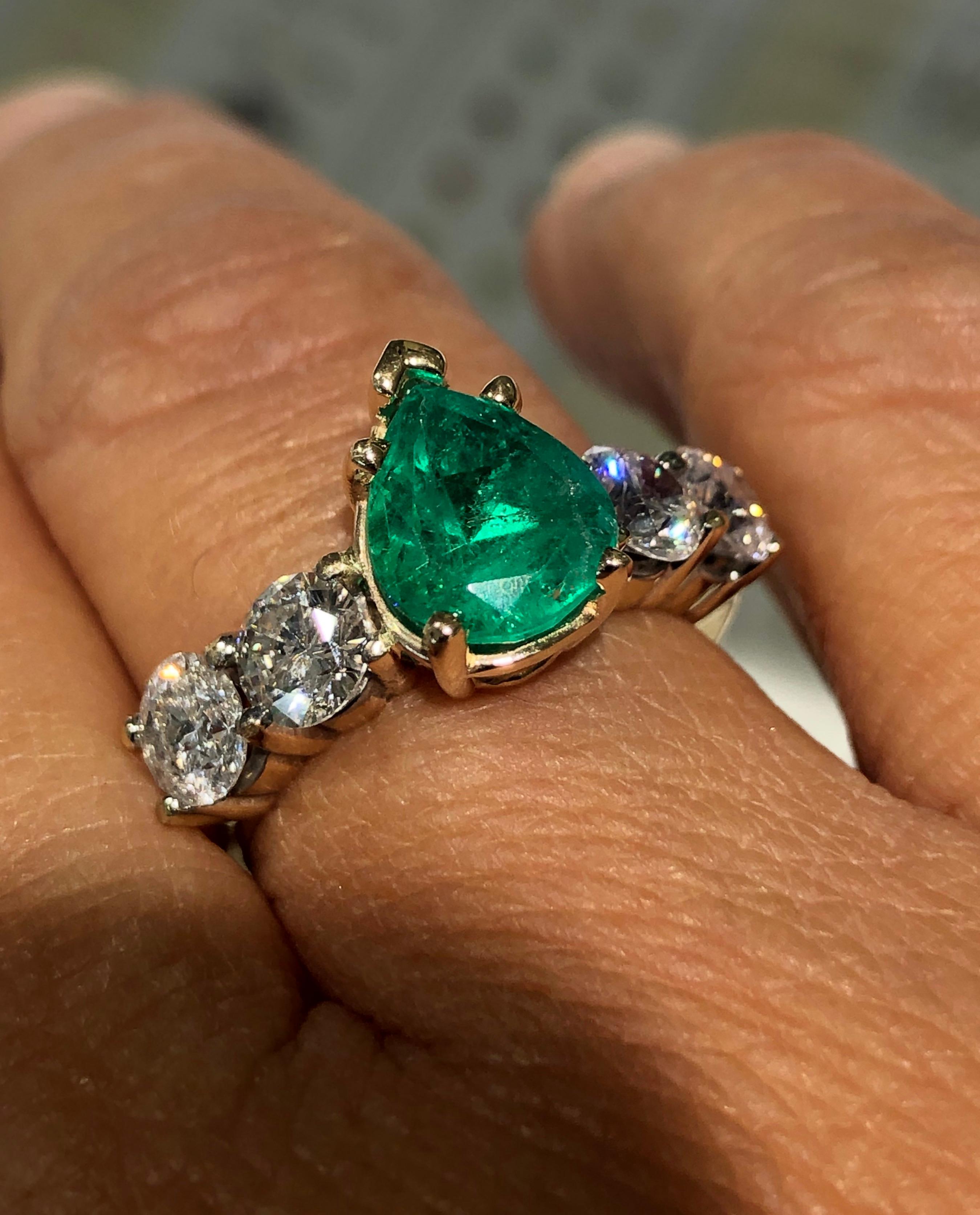 Estate Natural Colombian Emerald and Round Brilliant Cut Diamond Engagement Ring 14K Yellow Gold 
Natural Colombian Emerald, Pear Cut, Color/Clarity: Medium Green/ Clarity VS. Total Emerald Weight: 2.06 carat
Second Stone: Four Diamonds Round
