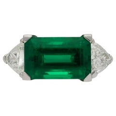 Colombian Emerald and Diamond Flanked Solitaire Ring