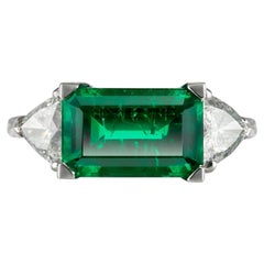 Colombian Emerald and Diamond Flanked Solitaire Ring