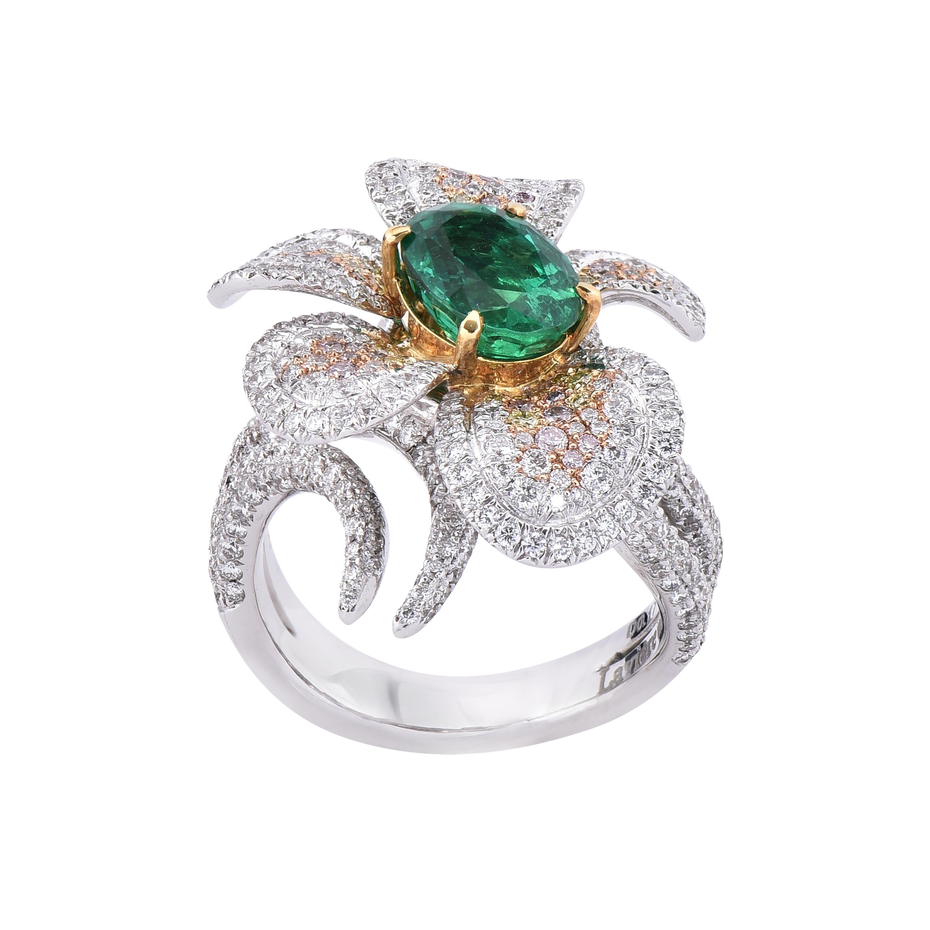 18 karat white & yellow gold emerald statement ring from the Veronese collection of Laviere. The ring is set with a 2.23 carats oval shape emerald, 2.11 carats round brilliant white, fancy pink and fancy yellow diamonds. 
Gold Weight 14.05 grams.