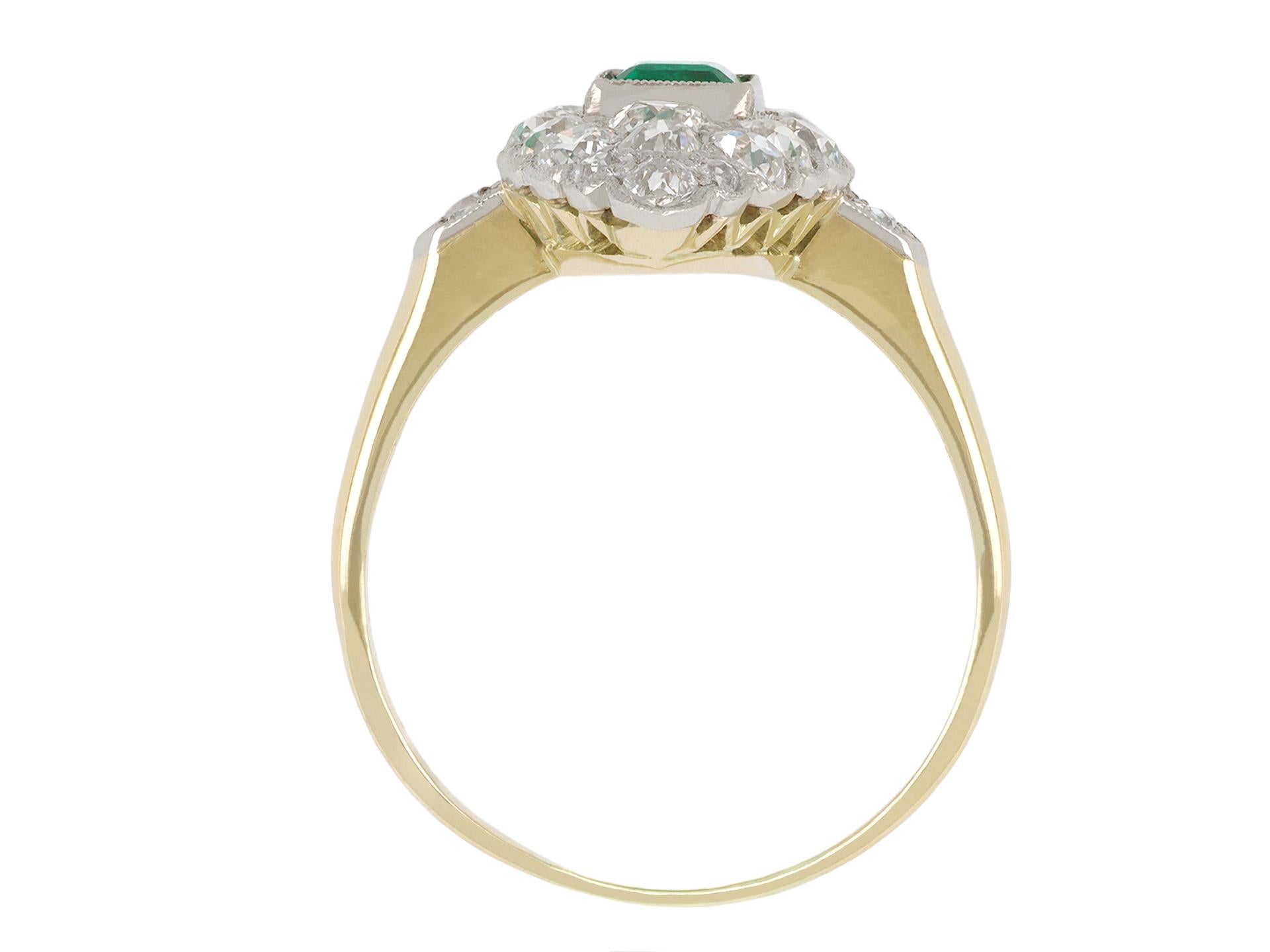 Edwardian Colombian emerald and diamond marquise cluster ring, circa 1905. For Sale