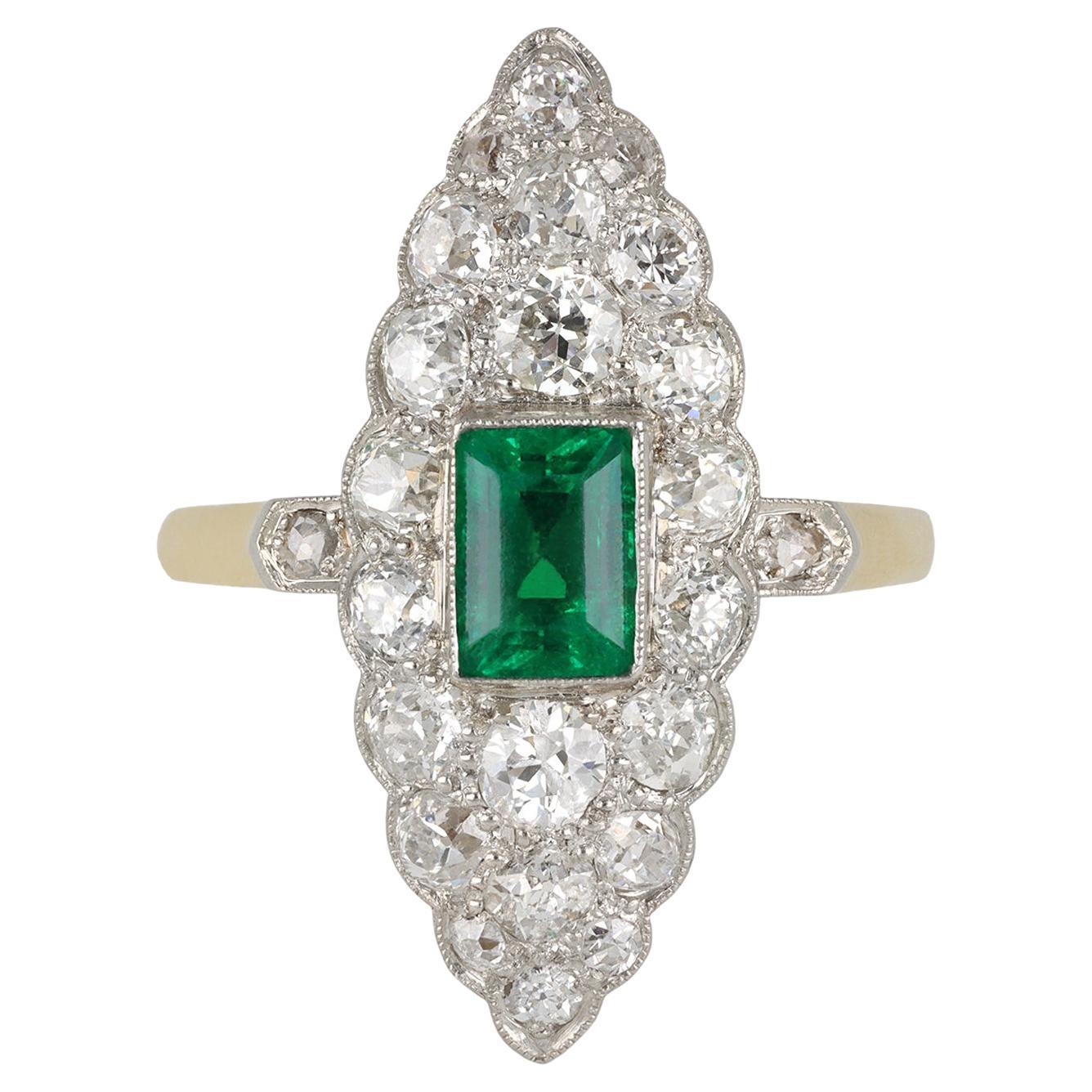 Colombian emerald and diamond marquise cluster ring, circa 1905. For Sale