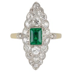Antique Colombian emerald and diamond marquise cluster ring, circa 1905.