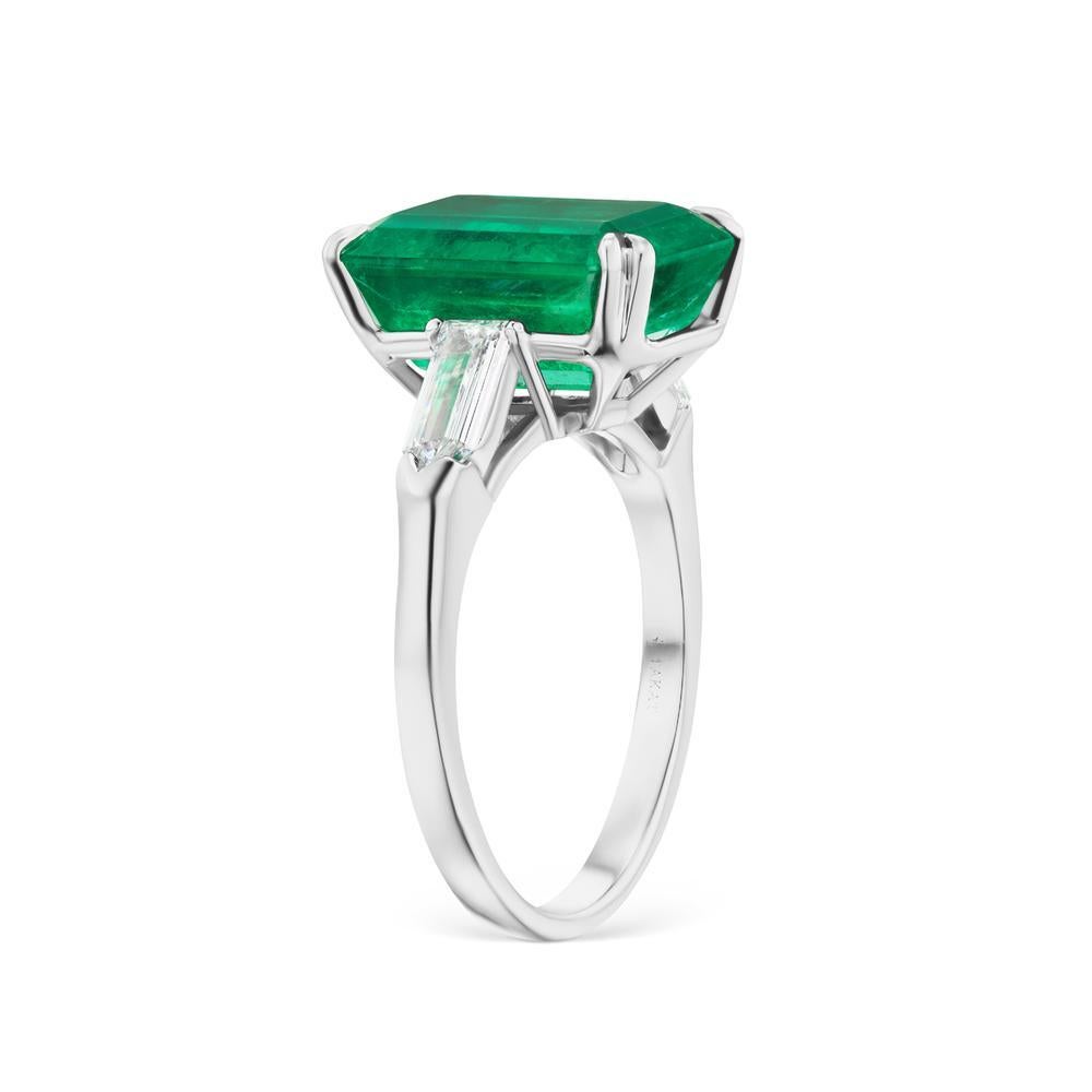 A timeless styling of extraordinary Colombian Emerald flanked by two bright fancy shape diamonds. A piece to be handed down through generations.
Item:	# 03362
Setting:	Platinum
Lab:	GIA
Color Weight:	6.9 ct. of Emerald
Diamond Weight:	0.72 ct. of