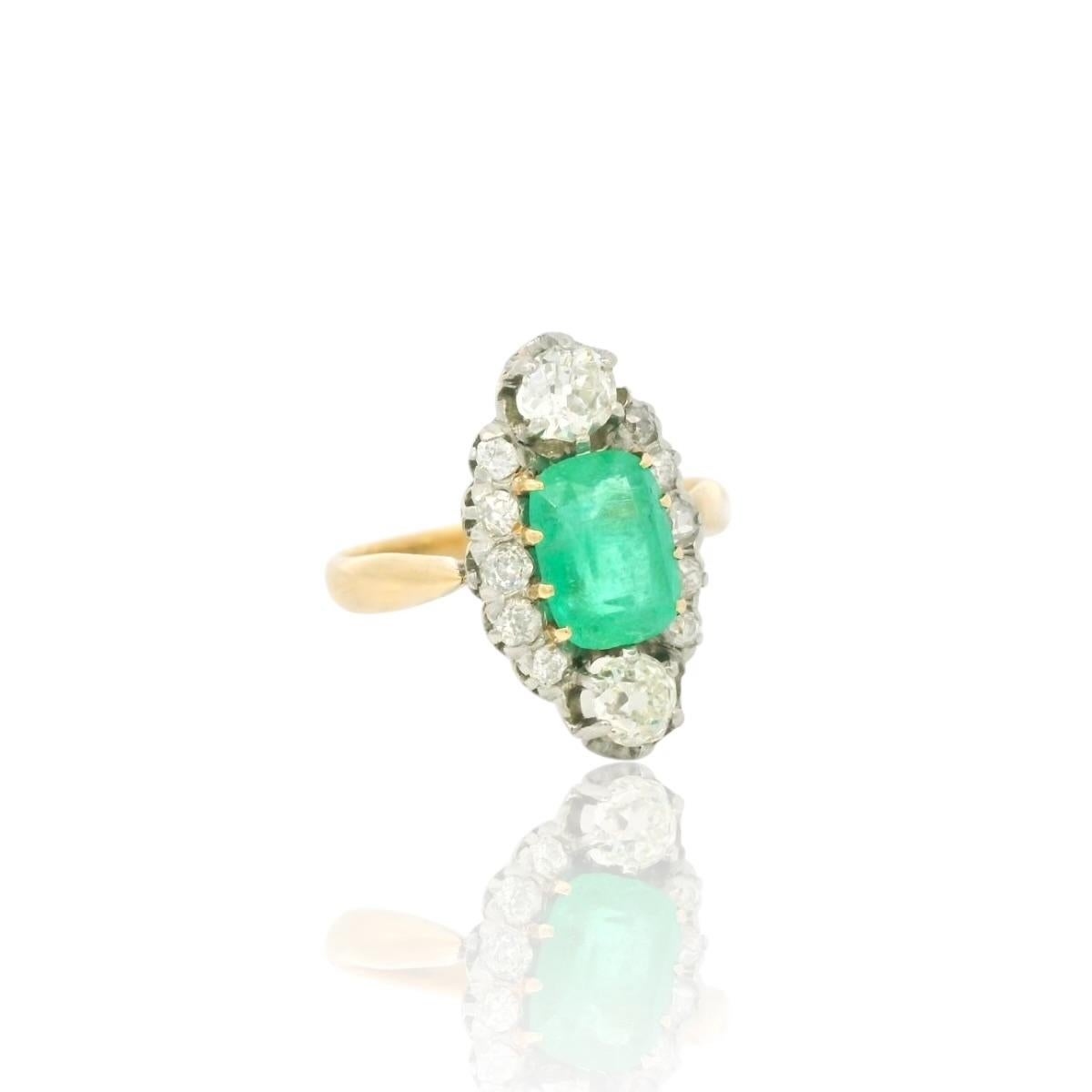 Antique diamond and emerald ring circa 1900.

Ring set with a center elongated cushion cut emerald of approximately 1.70 Carats ( Colombian), two old European cut diamonds for a total of approximately 0.60 Carats and 10 old European diamonds for a