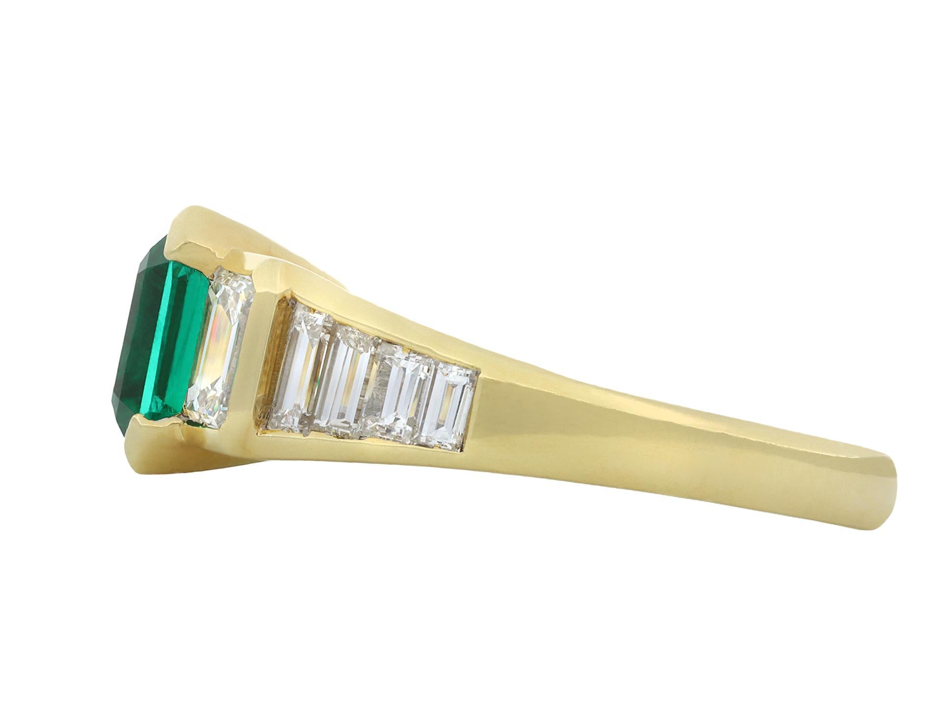 Colombian emerald and diamond flanked solitaire ring. Centrally set with an octagonal emerald-cut natural Colombian emerald with minor clarity enhancement in an open back half rubover setting with an approximate weight of 2.00 carats, flanked by two