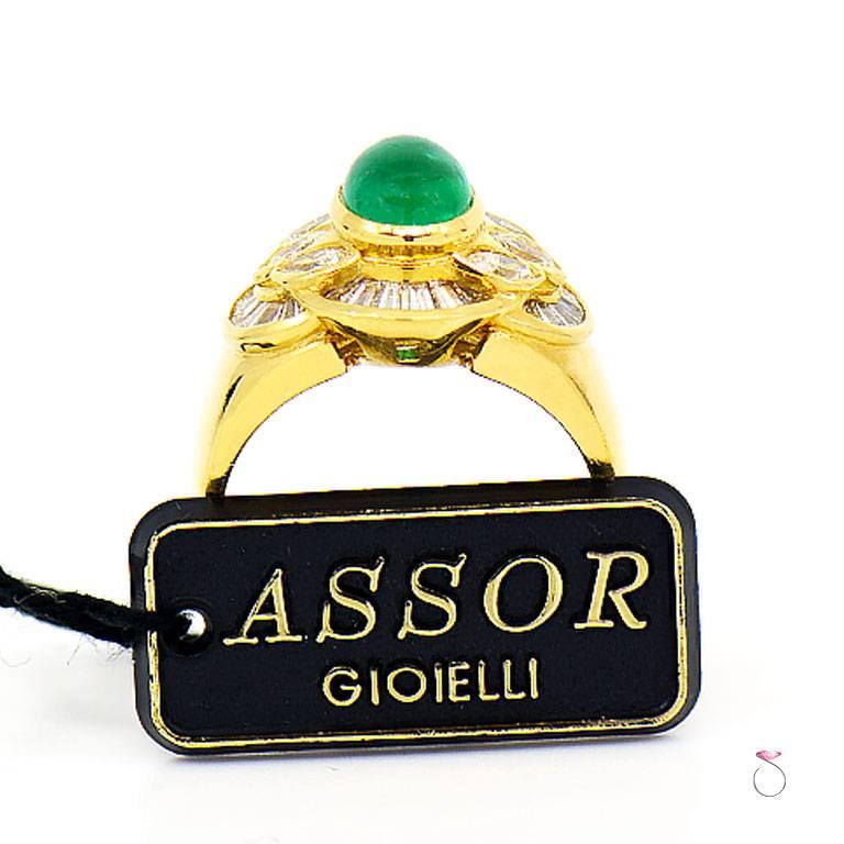 Designer Emerald ring by Assor Gioielli. Beautiful natural colombian emerald oval cabochon set in a well crafted 18k yellow gold ring & surrounded by a layered diamond halo of marquise & baguette diamonds. The 1.45 carat emerald measures