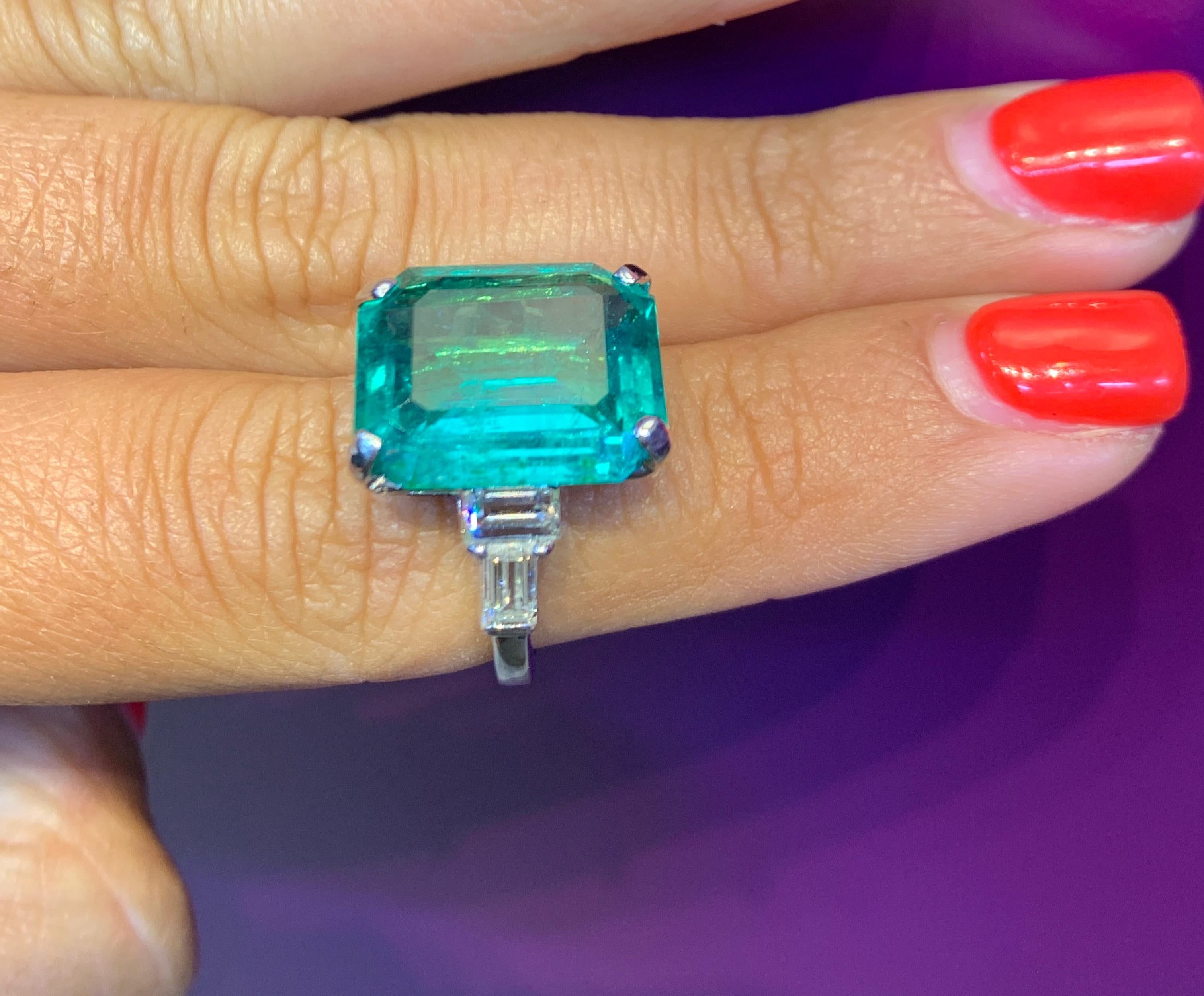 Colombian Emerald And Diamond White Gold Cocktail Ring 
Emerald Weight: 9.33 Cts
Ring Size: 4
Re-sizable Free of Charge 

