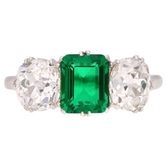 Colombian emerald and diamond three stone ring, circa 1920.
