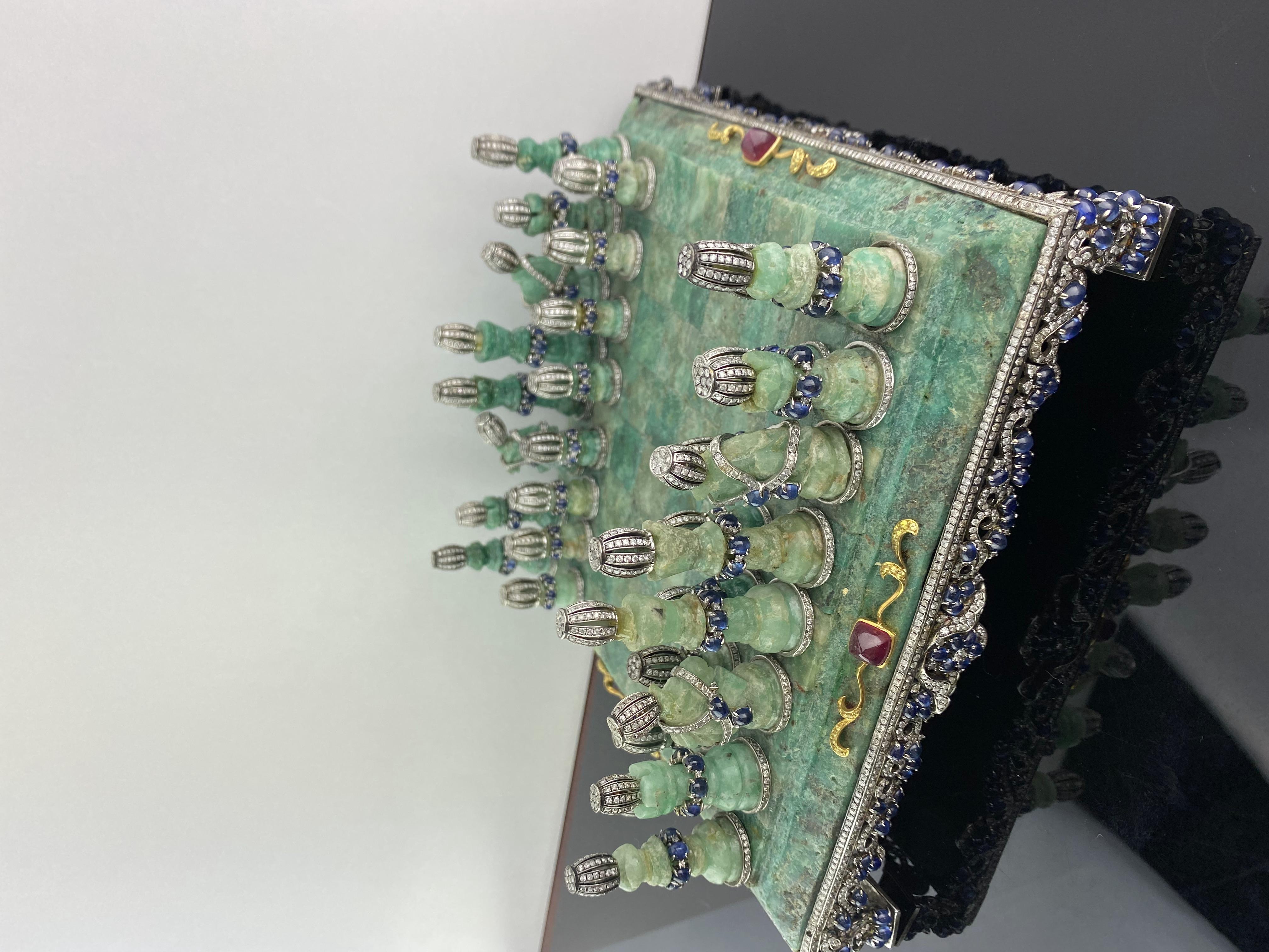 A truly unique Colombian Emerald Chess board and pieces, embellished with natural Rubies, Diamonds and Sapphires in solid 18K Gold. 
This is a collector piece. 
Feel free for more information/photos/videos of this item.