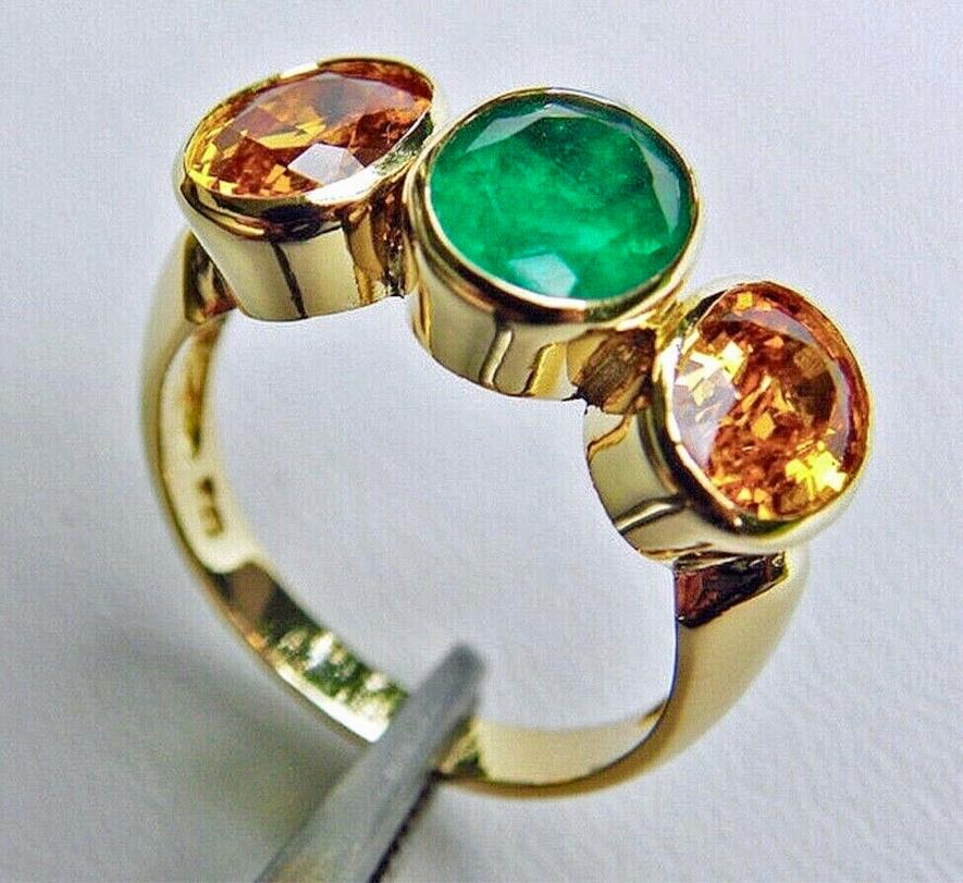 Oval Cut Emerald Yellow Sapphire Three Stone Ring 18 Karat Yellow Gold For Sale
