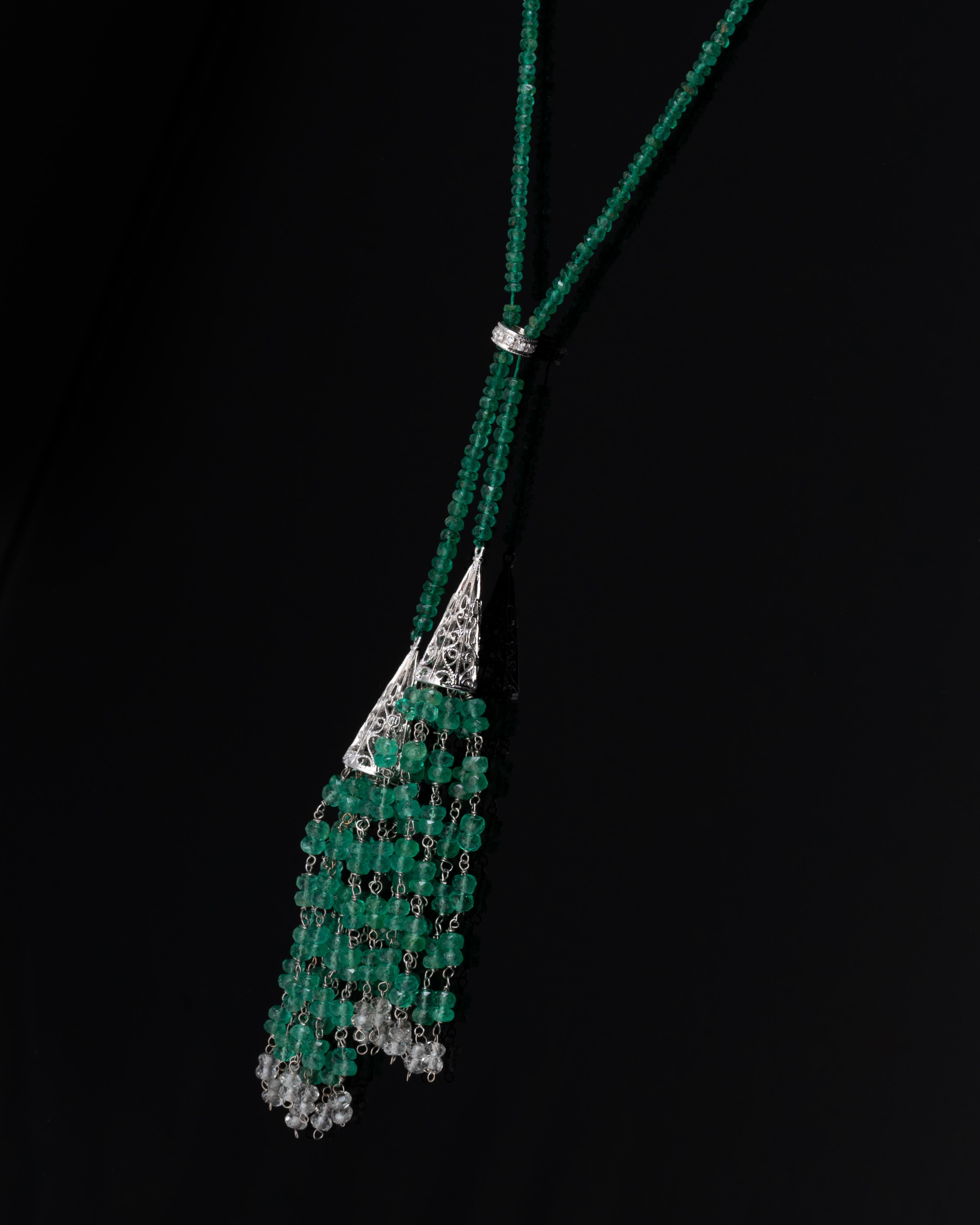 A lovely, art-deco  necklace with 100 carats of high-quality, faceted natural Colombian Emerald beads with Diamonds set in 18K White Gold. The necklace is around 18.5 inches long. 

This necklace is simple, yet it makes a statement! We are open to