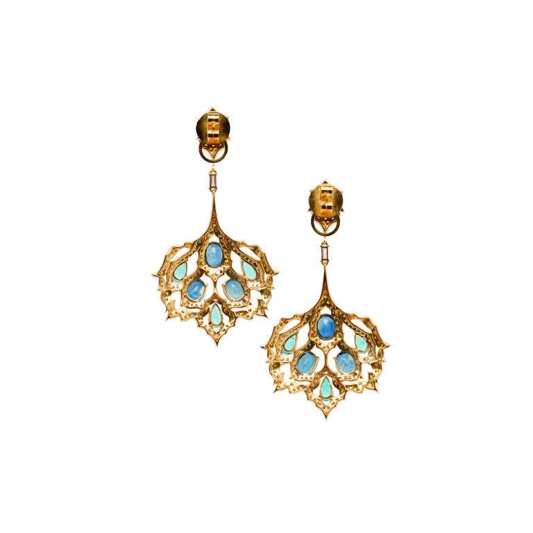 The Grape Leaves Earrings from 'The Poetry of Art Collection' by Austy Lee. This collection demonstrates Austy's perspective on aesthetics drawn from all corners of the world. This unique pair of earrings is composed of Natural Sri Lankan Blue