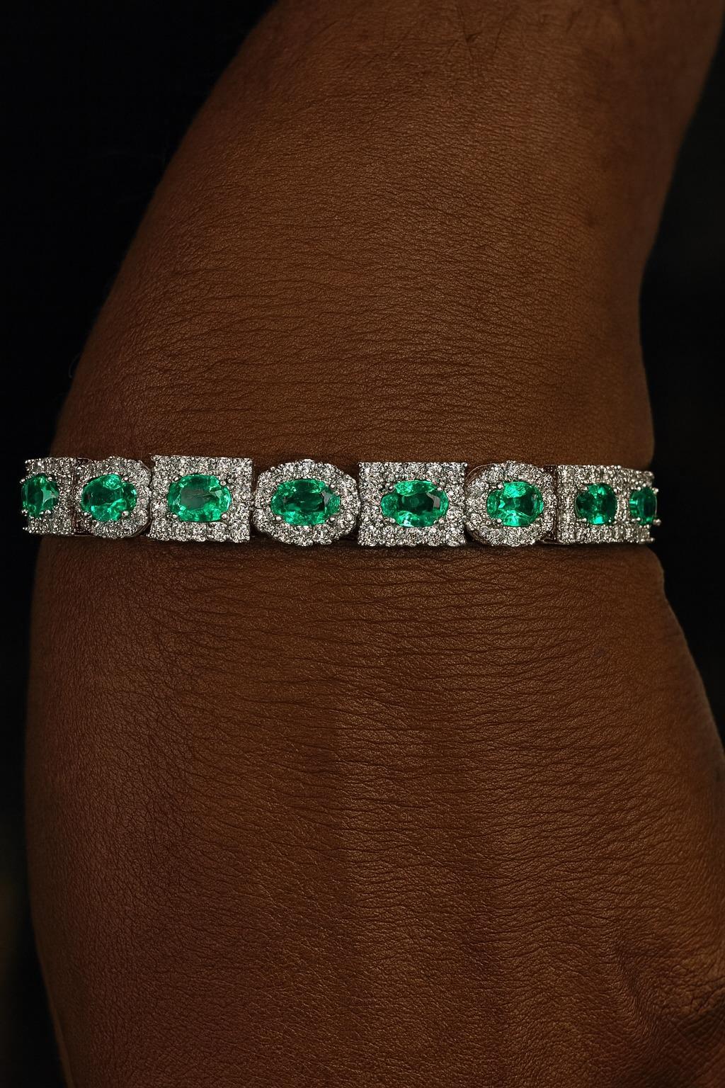 Oval Cut Colombian Emerald & Diamond 10.50 Carat Halo Tennis Bracelet in 18K White Gold For Sale