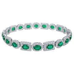 Colombian Emerald & Diamond 10.50 Carat Halo Tennis Bracelet in 18K White Gold