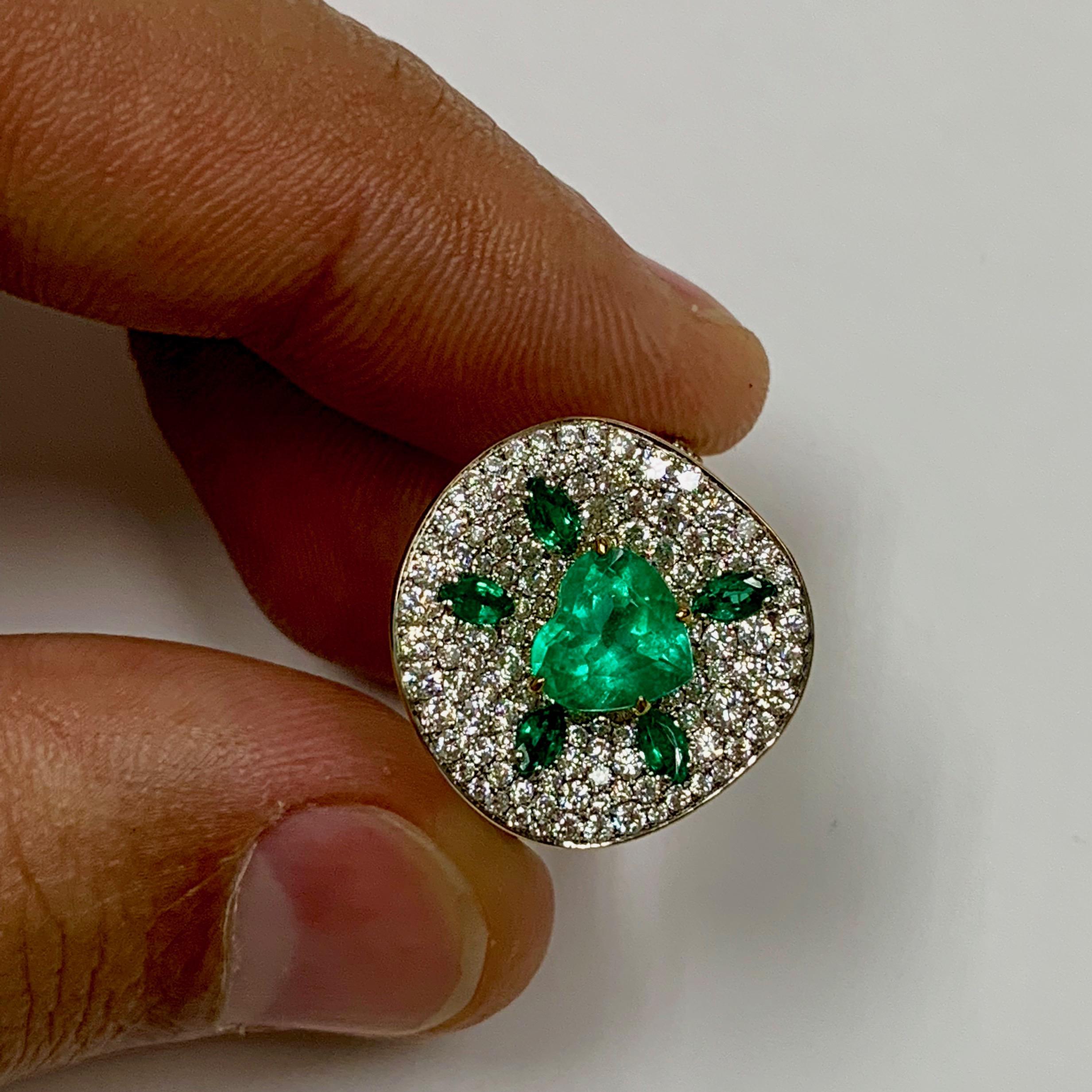 Colombian Emerald Diamond 18 Karat Yellow Gold Ring 
Emeralds and diamonds - always winning combination. Here we support the central Colombian Emerald of 1,37 carat with 1,93 carat of pure White Diamonds. 
In set with Earrings