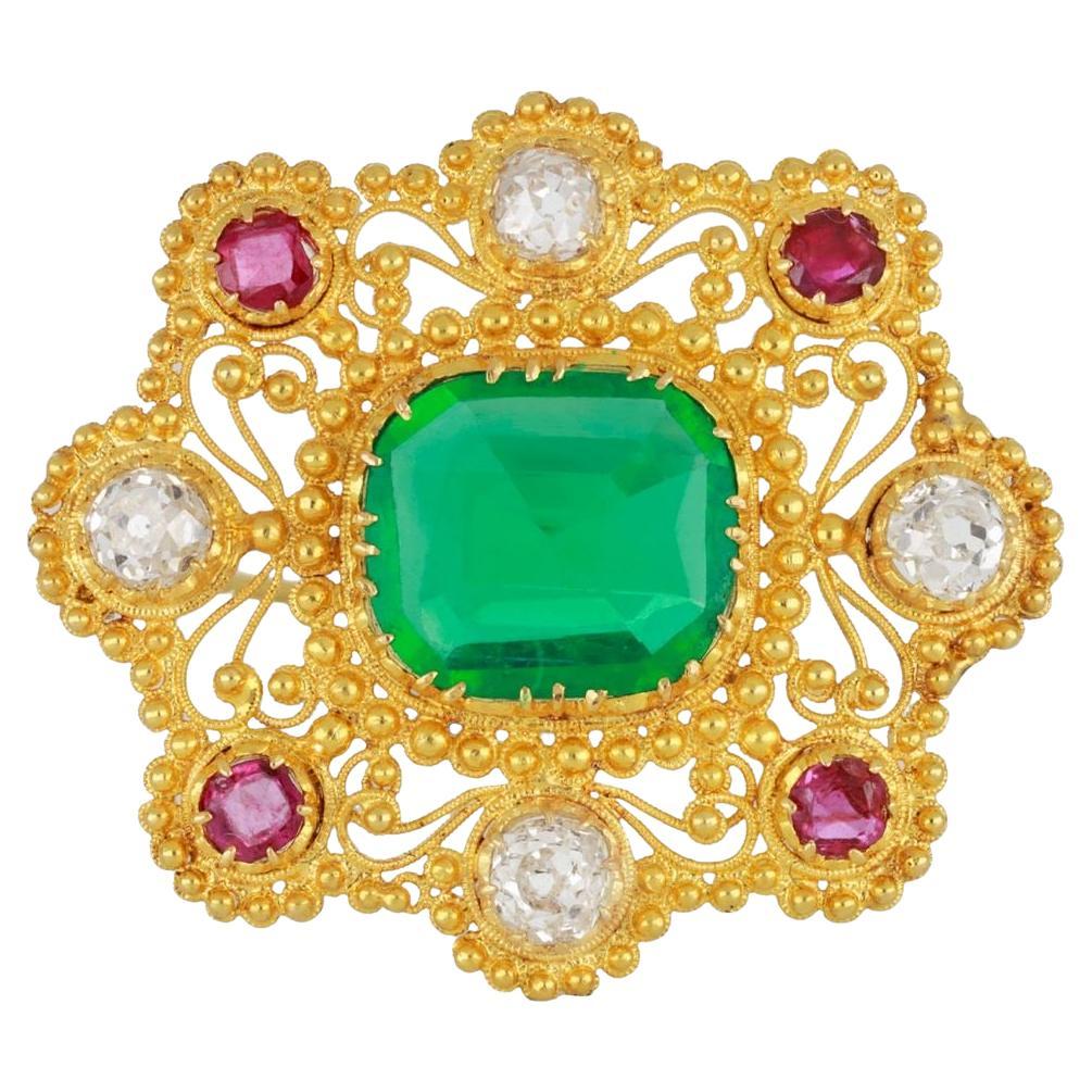 Colombian emerald, diamond and ruby cannetille brooch, circa 1830.