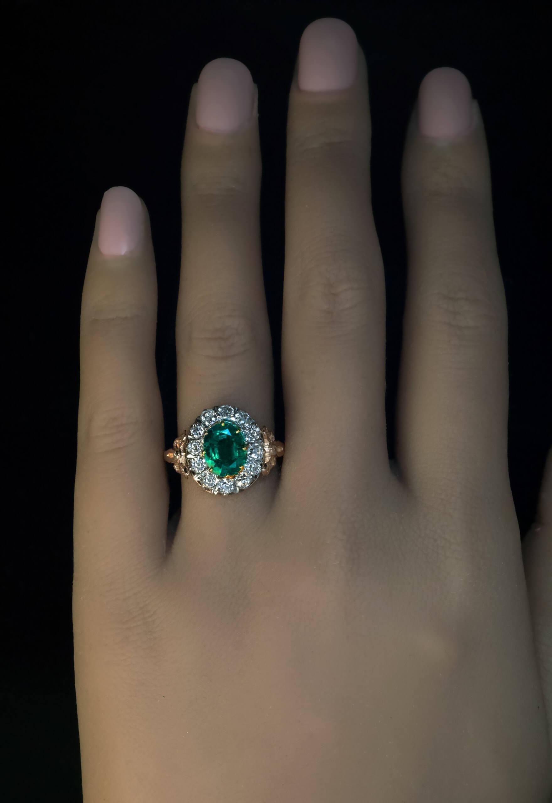 This rare antique Russian ring was made in Moscow between 1908 and 1917.  The ring is crafted in 14K gold and features an excellent 1.51 carat Colombian emerald of a deep bluish green color, framed by sparkling old mine cut diamonds (G-H color, SI