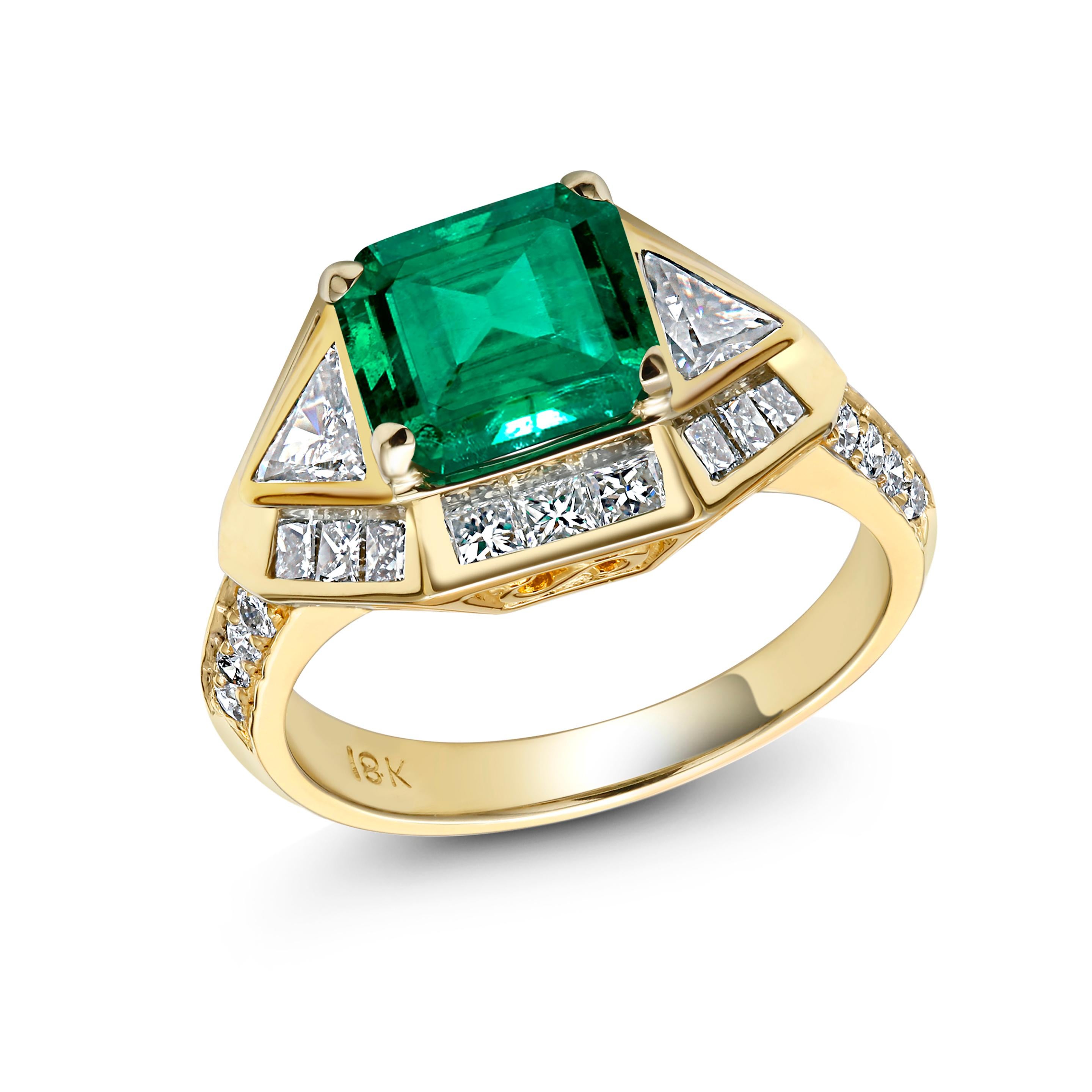 One of a kind eighteen karat yellow gold emerald cut emerald cocktail ring
Emerald weighing 2.32 carat
Princess cut diamond weighing 0.71 carat 
Trillion diamond weighing 0.32 carat
Round diamond weighing 0.22 carat 
Ring size 6 In Stock
Ring can be