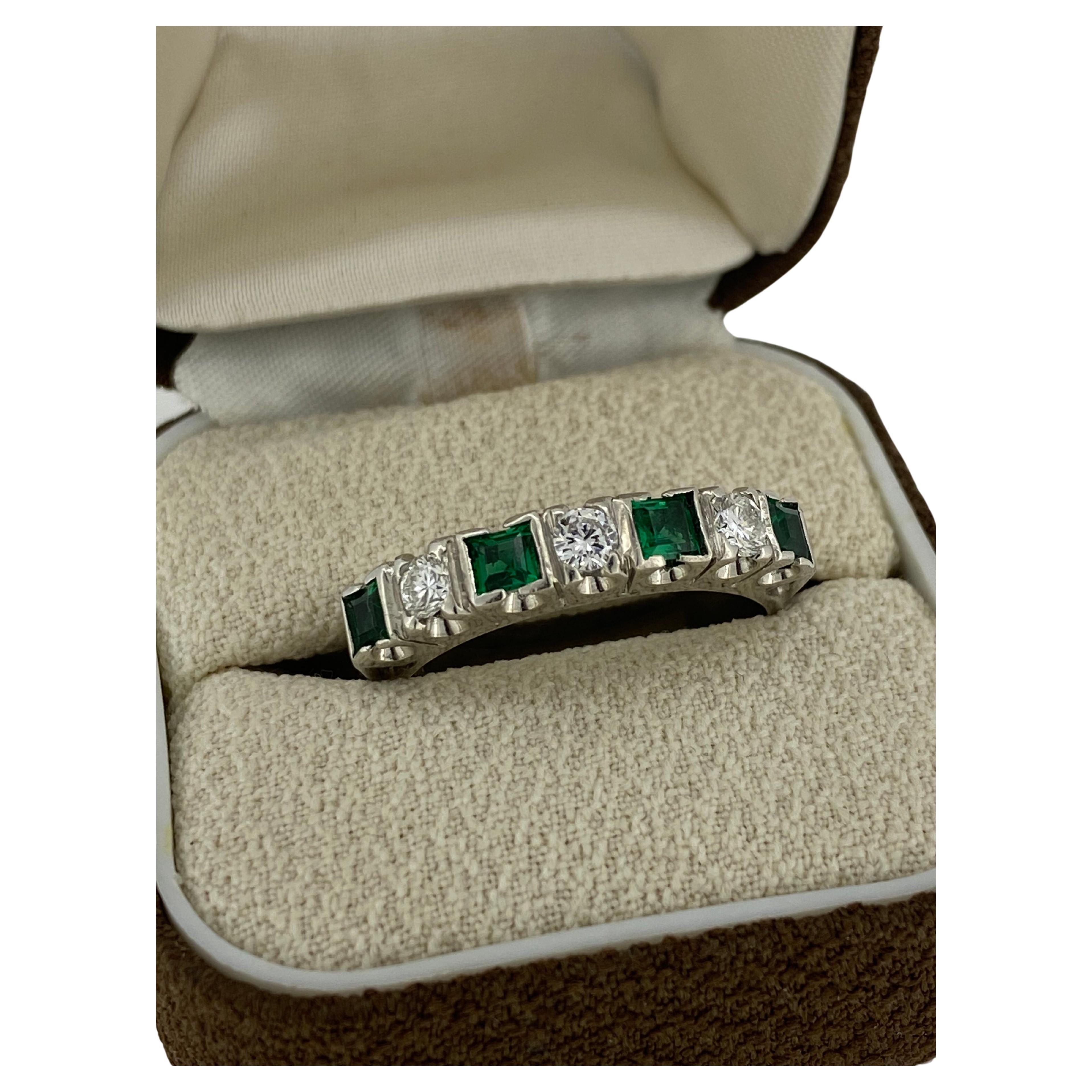 Of elegant, timeless & easy-to-wear design, 
this half hoop band is Retro, 
dating back to 1950's 

~~~

Prong set with 4 Princess Cut Natural Colombian Emeralds
of superb & vibrant grass green colour & excellent clarity 
totalling 0.80ct approx.