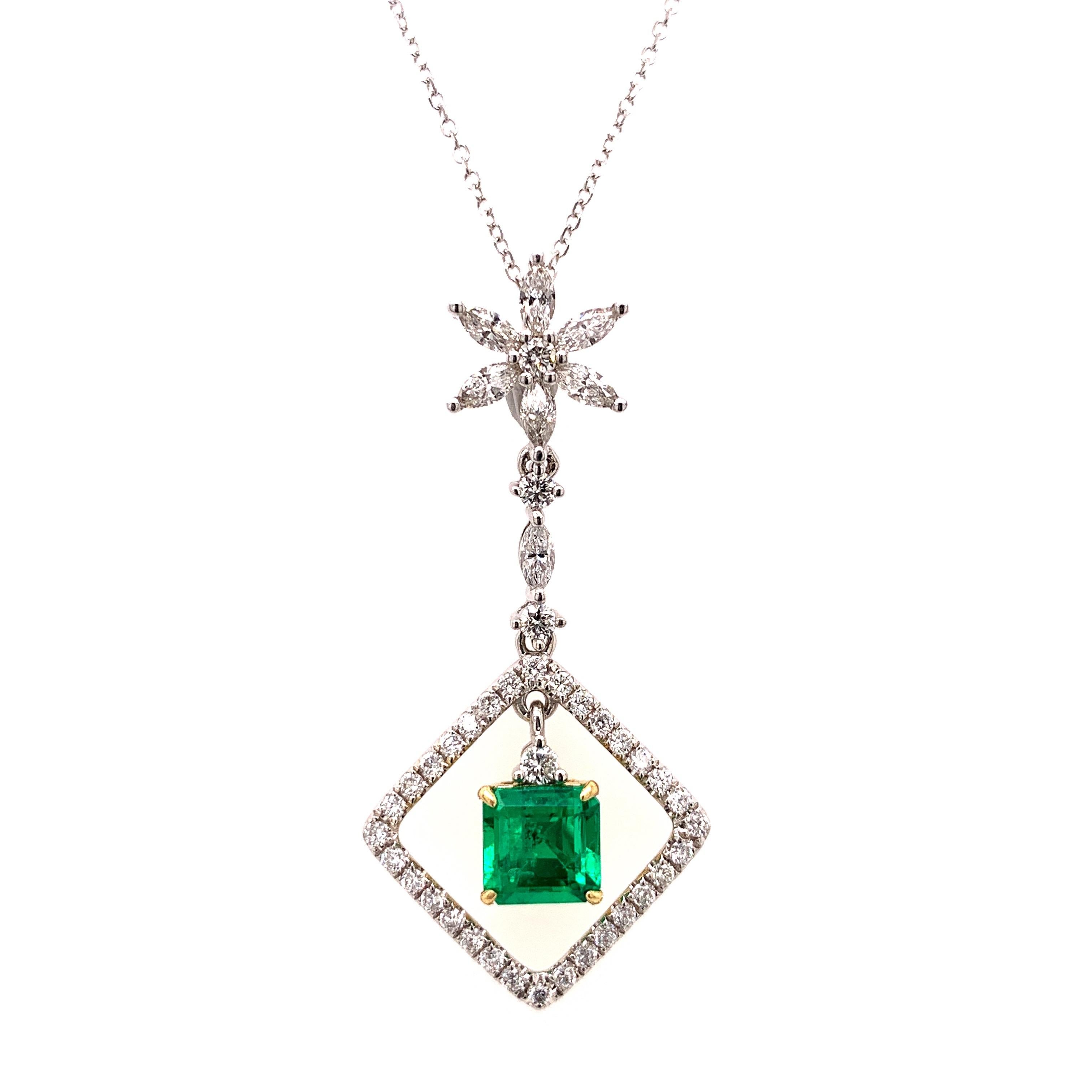 Elegant dangling emerald diamond pendant. Lively green, transparent, high lustre, square faceted, natural Colombian 1.01 carats emerald mounted in high profile open basket with four prongs in dangling setting, accented with marquise and round