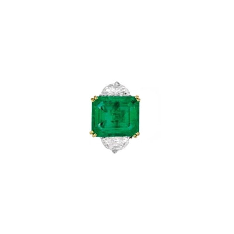 Colombian Emerald weighing 11.0 Carats flanked by half moon Diamonds weighing 2.02 Carats. Set in Platinum and 18 Karat Yellow Gold.
Finger Size 6.25.
Can be resized.