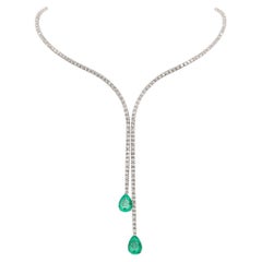 Collier tennis fendu en émeraude colombienne et diamant