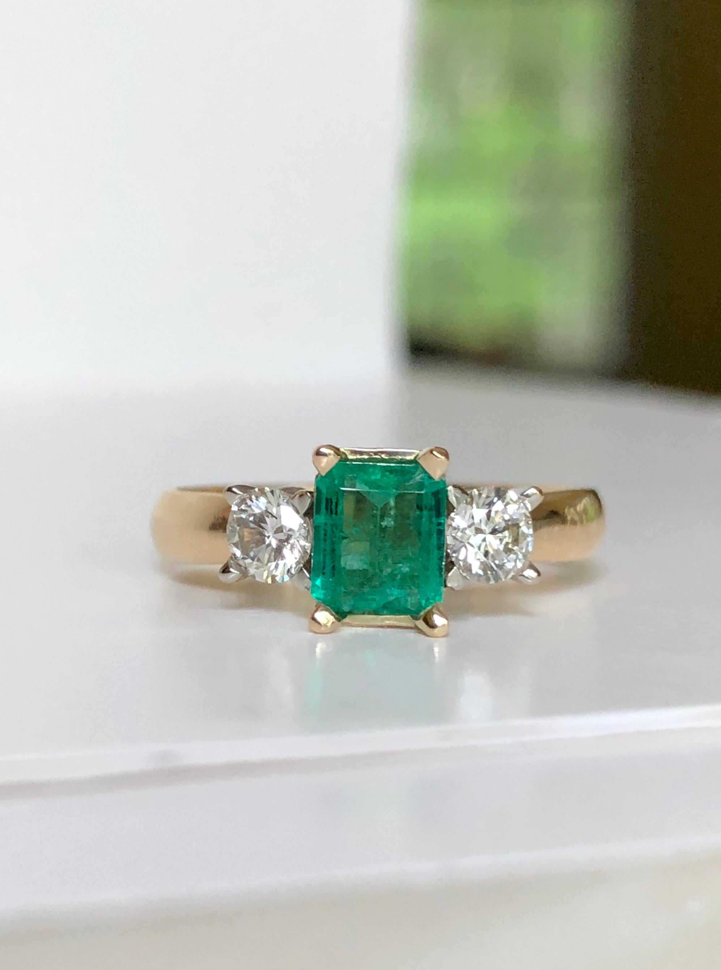 18K yellow gold natural Emerald and Diamond Engagement Ring 3 Stone emerald cut emerald. 
Total Emerald weight is 0.51 carats, high clarity, rich green color, excellent brightness from 
Colombia. Total Diamond weight is 0.38 carats, round brilliant