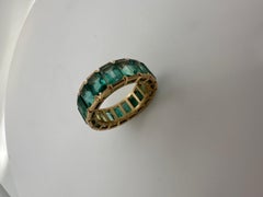 Zambian emerald eternity ring 18KT matte finish yellow gold