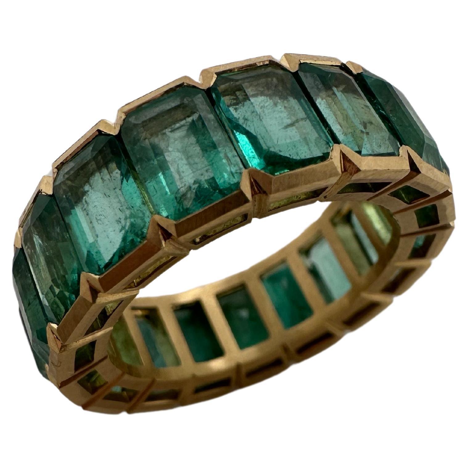 Colombian emerald eternity ring 18KT matte finish yellow gold For Sale