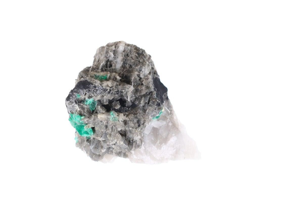 Rough Emerald-
Color: Green
Clarity: Translucent
Origin: Colombia

Sculpture-
Stone(s): Black Shale, Calcite, Pyrite
Measurement: 3