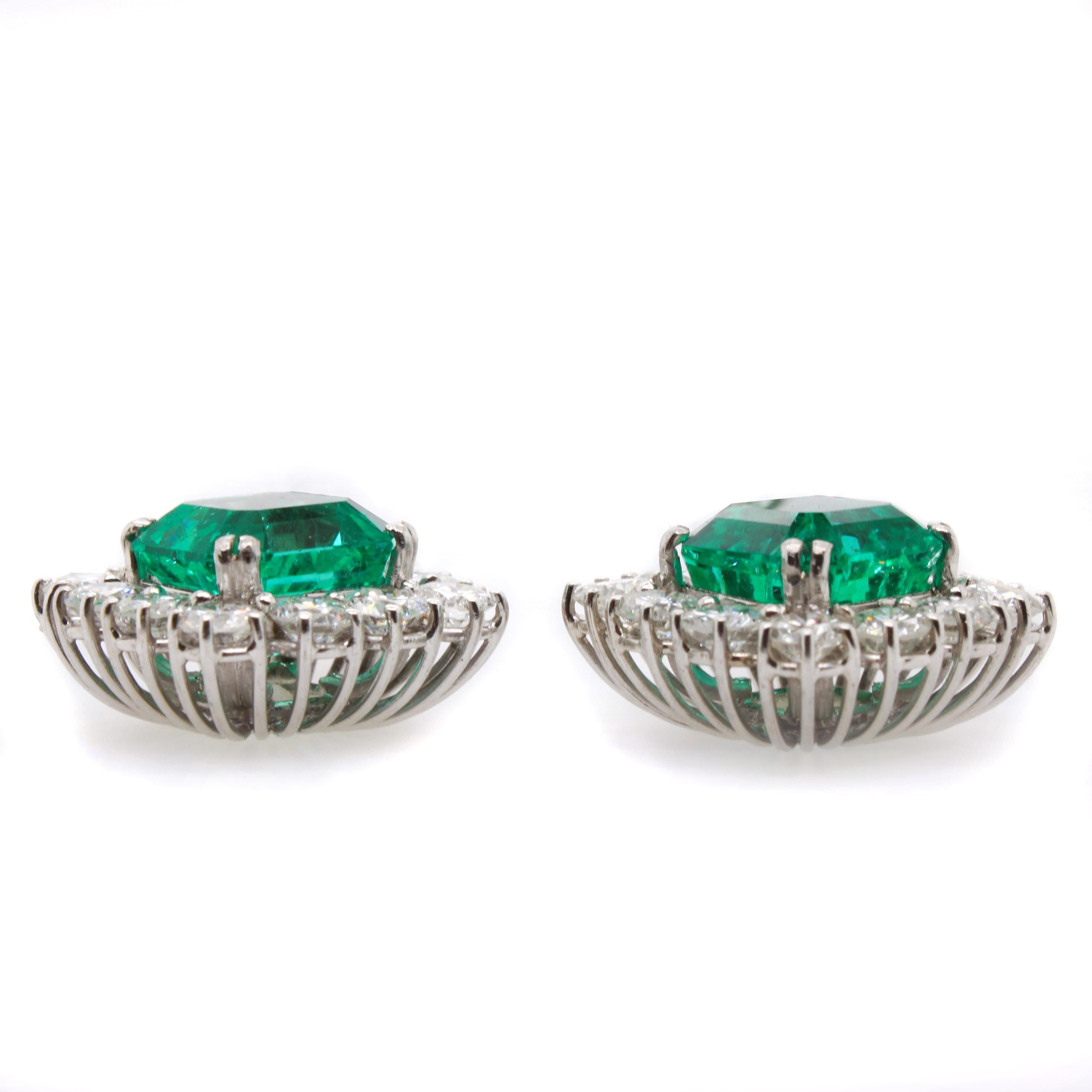 A pair of beautiful emerald and diamond earrings in white gold. The two square cut emerald have a medium green colour and stunning crystal. They are of Colombian origin and weigh 4.01ct (no-oil) and 4.58ct (minor oil) - accompanied by a gemological
