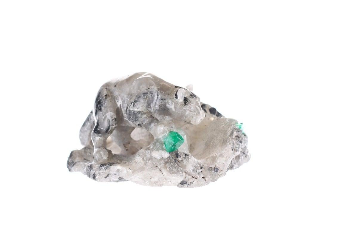 This beautiful and one-of-a-kind rough Colombian emerald sculpture. A hand-carved large cat, created by gray and black shale, white calcite and gorgeous natural Colombian emerald roughs. It is every collector's must-have item.

Rough Emerald-
Color: