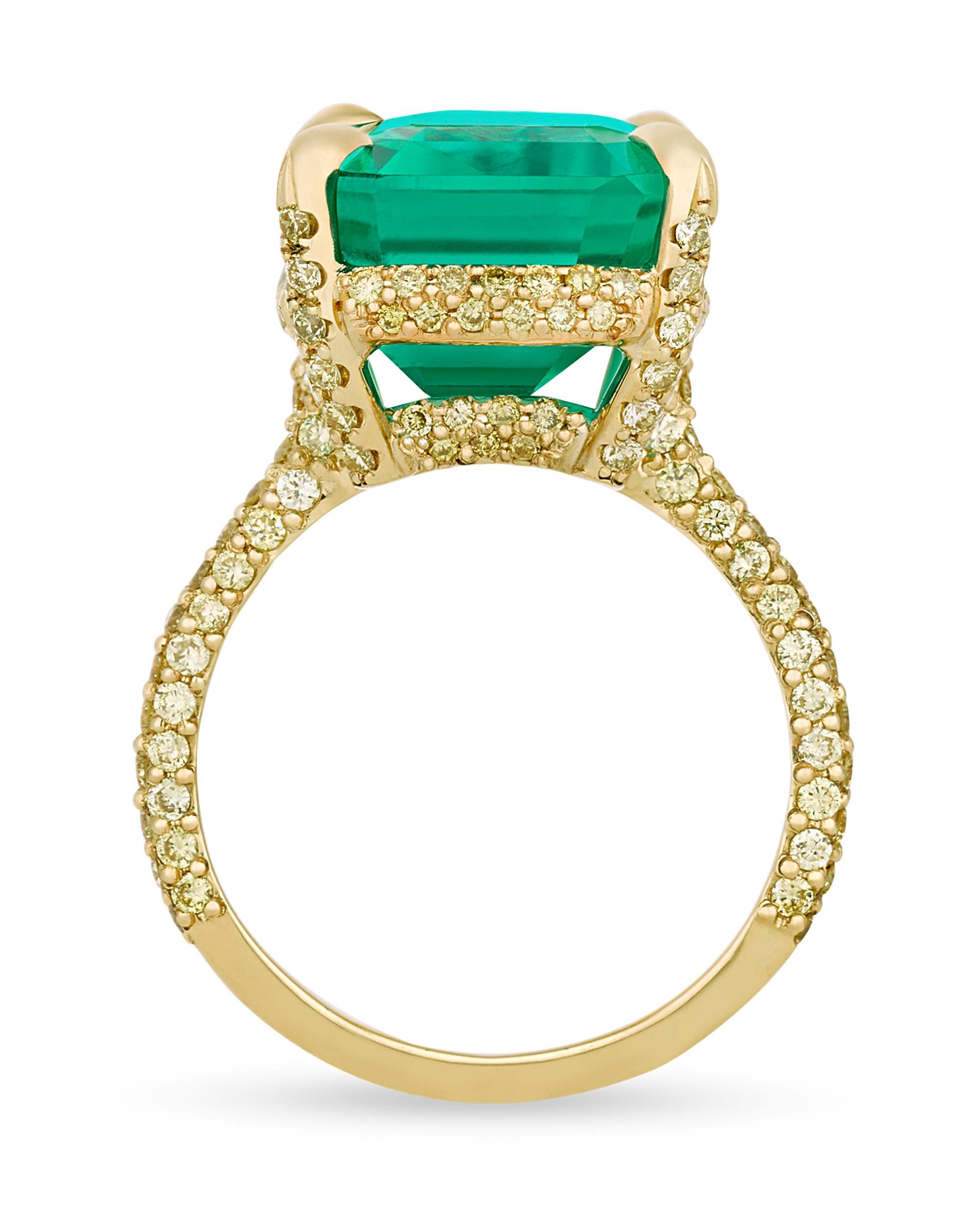 An extraordinary emerald-cut Colombian emerald displays an incredible depth of color and brilliance in this eye-catching ring. Possessing the “Old Mine” green hue that makes Colombian emeralds so desirable, the 13.67-carat gem is perfectly