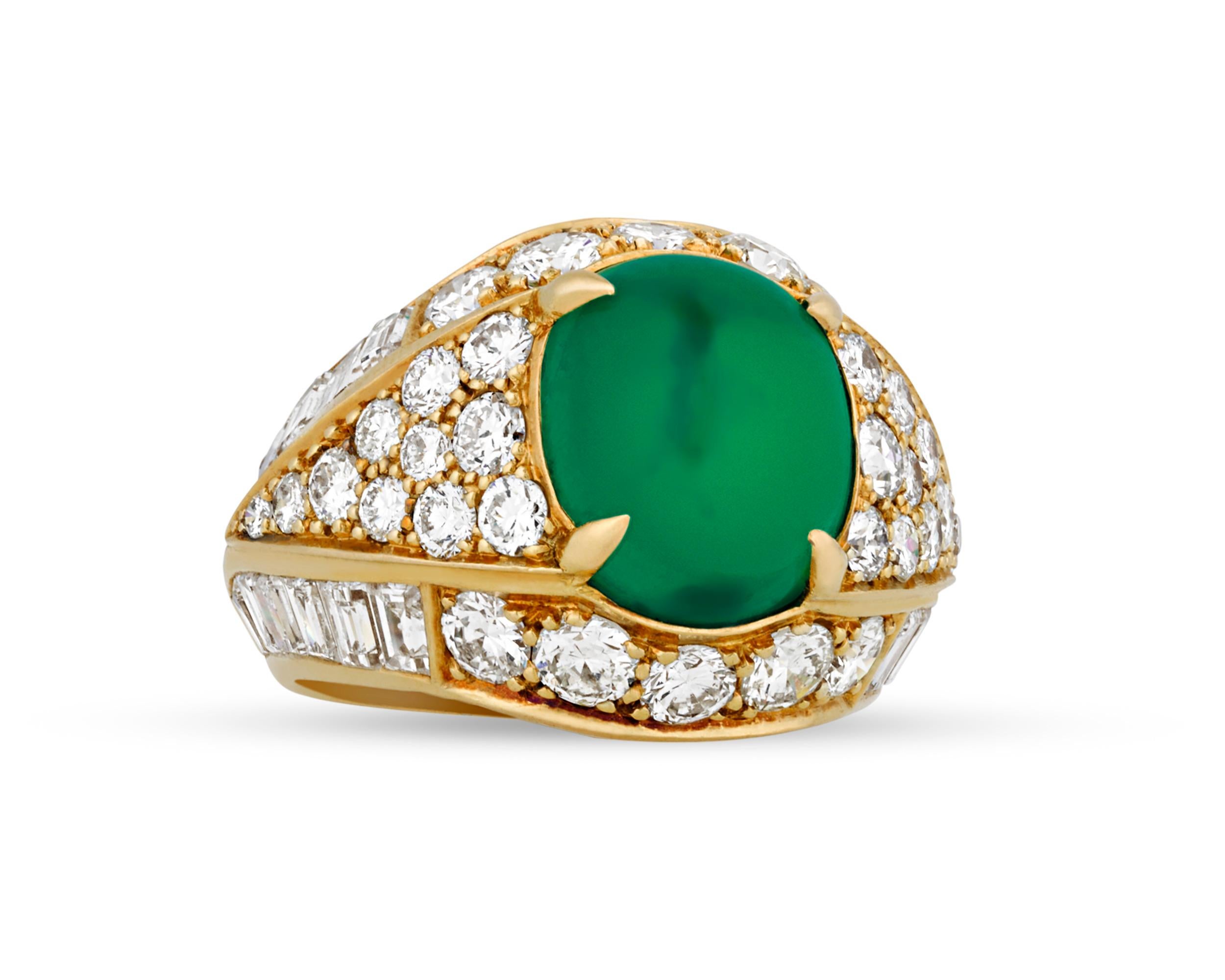 A mesmerizing cabochon Colombian emerald weighing approximately 5.40 carats exhibits a deep green hue in this bombe-style ring by the legendary firm of Van Cleef & Arpels. For centuries, Colombia has been the prime location for mining the finest