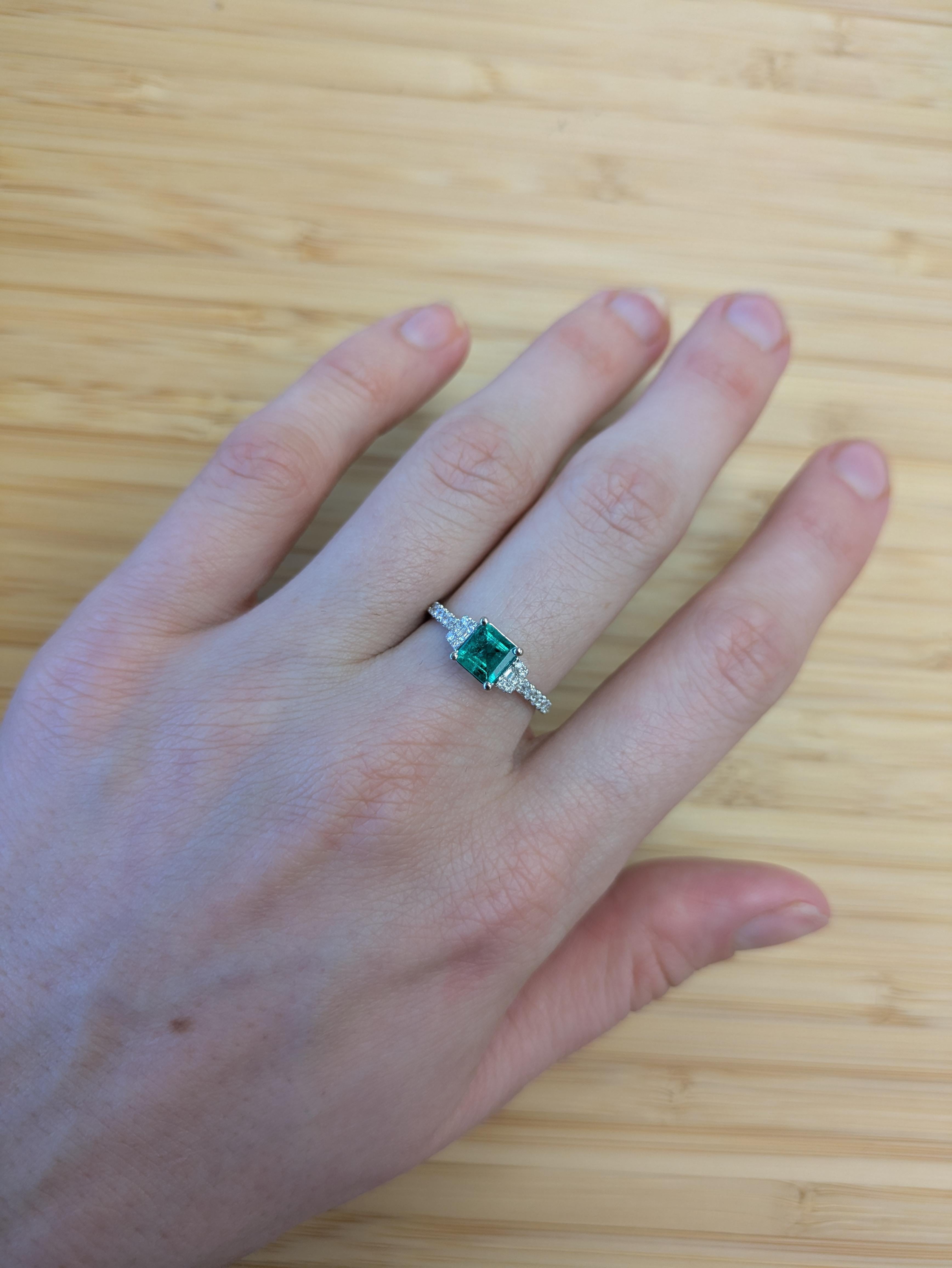 A beautiful Asscher-cut Colombian Emerald takes center stage in this elegant 14K white gold ring. Earth-mined diamond accents add sparkle and depth, making it a stunning and meaningful choice for an engagement or special occasion.

**We offer