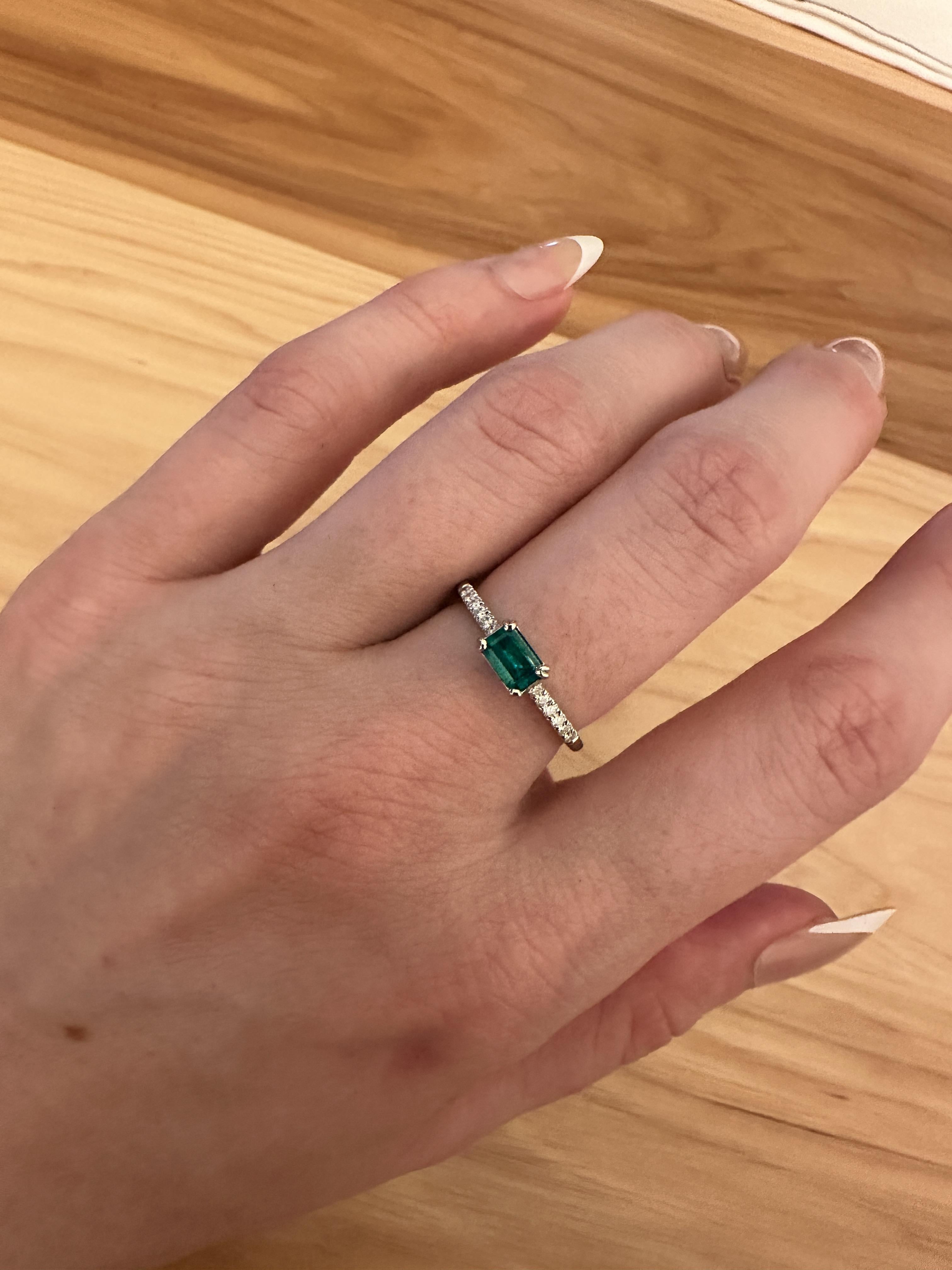 This dainty ring design features a stunning vibrant Colombian emerald in solid 14K white gold with natural earth mined diamond accents. This staple ring makes for a stunning accessory to any look. This ring also makes a beautiful August birthstone